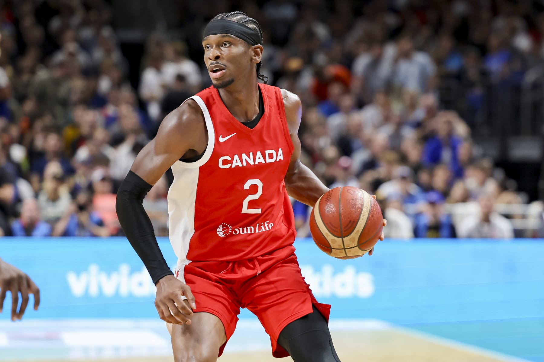 BERLIN, GERMANY - AUGUST 9: Shai Gilgeous-Alexander of Canada controls the ball during the Basketball Friendly match between Germany and Canada at Mercedes-Benz Arena on August 9, 2023 in Berlin, Germany. (Photo by Marco Steinbrenner/DeFodi Images via Getty Images)