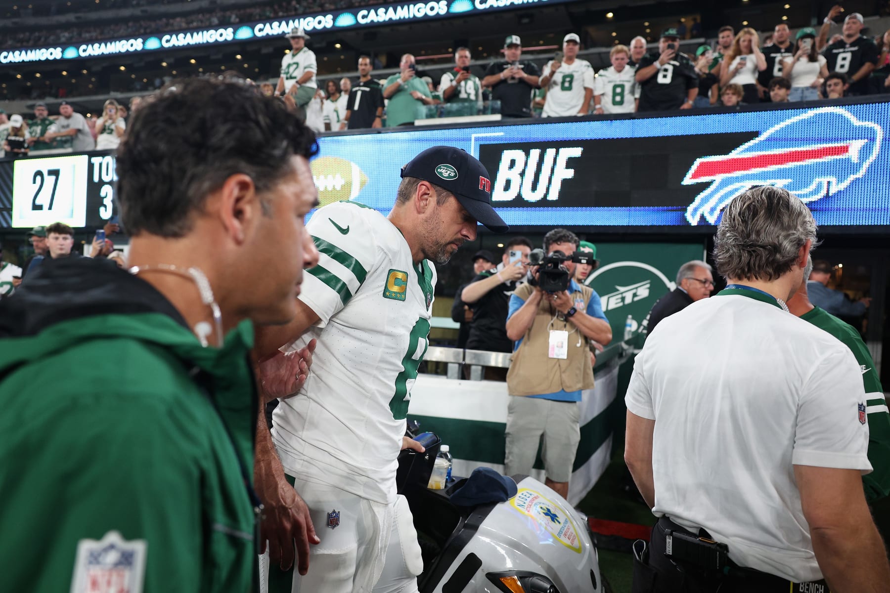 EAST RUTHERFORD, NEW JERSEY - SEPTEMBER 11: Quarterback Aaron Rodgers #8 of the New York Jets is helped off the field after an injury during the first quarter of the NFL game against the Buffalo Bills at MetLife Stadium on September 11, 2023 in East Rutherford, New Jersey. (Photo by Elsa/Getty Images) EAST RUTHERFORD, NEW JERSEY - SEPTEMBER 11: Quarterback Aaron Rodgers #8 of the New York Jets is helped off the field after an injury during the first quarter of the NFL game against the Buffalo Bills at MetLife Stadium on September 11, 2023 in East Rutherford, New Jersey. (Photo by Elsa/Getty Images)
