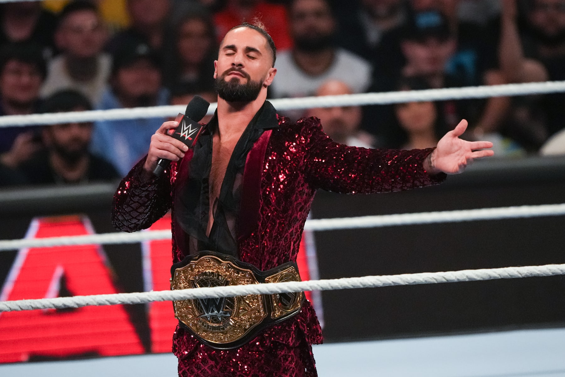 HOUSTON, TEXAS - MARCH 11: Seth Rollins gestures to the crowd during WWE Monday Night RAW at Toyota Center on March 11, 2024 in Houston, Texas. (Photo by Alex Bierens de Haan/Getty Images)