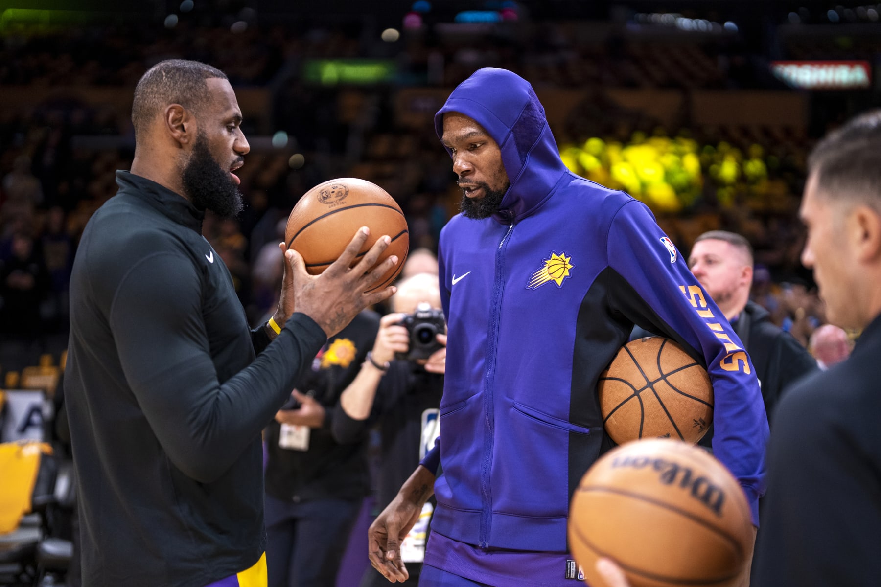 LOS ANGELES, CA - OCTOBER 26: LeBron James #23 of the Los Angeles Lakers and Kevin Durant #35 of the Phoenix Suns speak before the game on October 26, 2023 at Crypto.Com Arena in Los Angeles, California. NOTE TO USER: User expressly acknowledges and agrees that, by downloading and/or using this Photograph, user is consenting to the terms and conditions of the Getty Images License Agreement. Mandatory Copyright Notice: Copyright 2023 NBAE (Photo by Tyler Ross/NBAE via Getty Images)