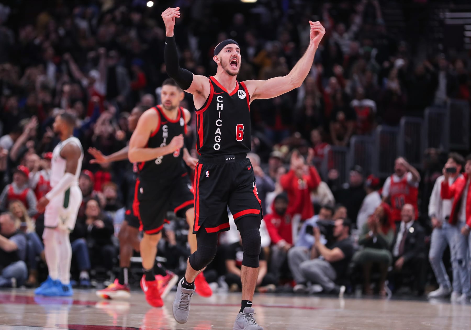 CHICAGO, IL - NOVEMBER 30: Alex Caruso #6 of the Chicago Bulls reacts during overtime against the Milwaukee Bucks at the United Center on November 30, 2023 in Chicago, Illinois. (Photo by Melissa Tamez/Icon Sportswire via Getty Images)