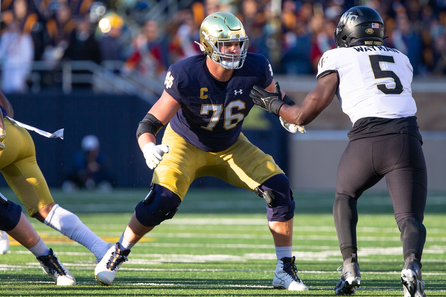 SOUTH BEND, IN - NOVEMBER 18: Joe Alt #76 of Notre Dame prepares to block Kendron Wayman #5 of Wake Forest during a game between Wake Forest University and University of Notre Dame at Notre Dame Stadium on November 18, 2023 in South Bend, Indiana. (Photo by Michael Miller/ISI Photos/Getty Images)