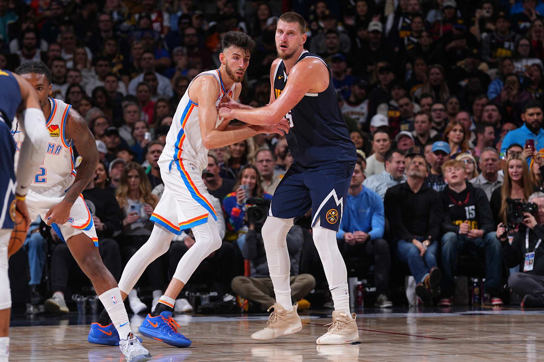 DENVER, CO - NOVEMBER 6:  Chet Holmgren #7 of the Oklahoma City Thunder and Nikola Jokic #15 of the Denver Nuggets during a regular season game on November 6, 2024 at Ball Arena in Denver, Colorado. NOTE TO USER: User expressly acknowledges and agrees that, by downloading and/or using this Photograph, user is consenting to the terms and conditions of the Getty Images License Agreement. Mandatory Copyright Notice: Copyright 2024 NBAE (Photo by Bart Young/NBAE via Getty Images)