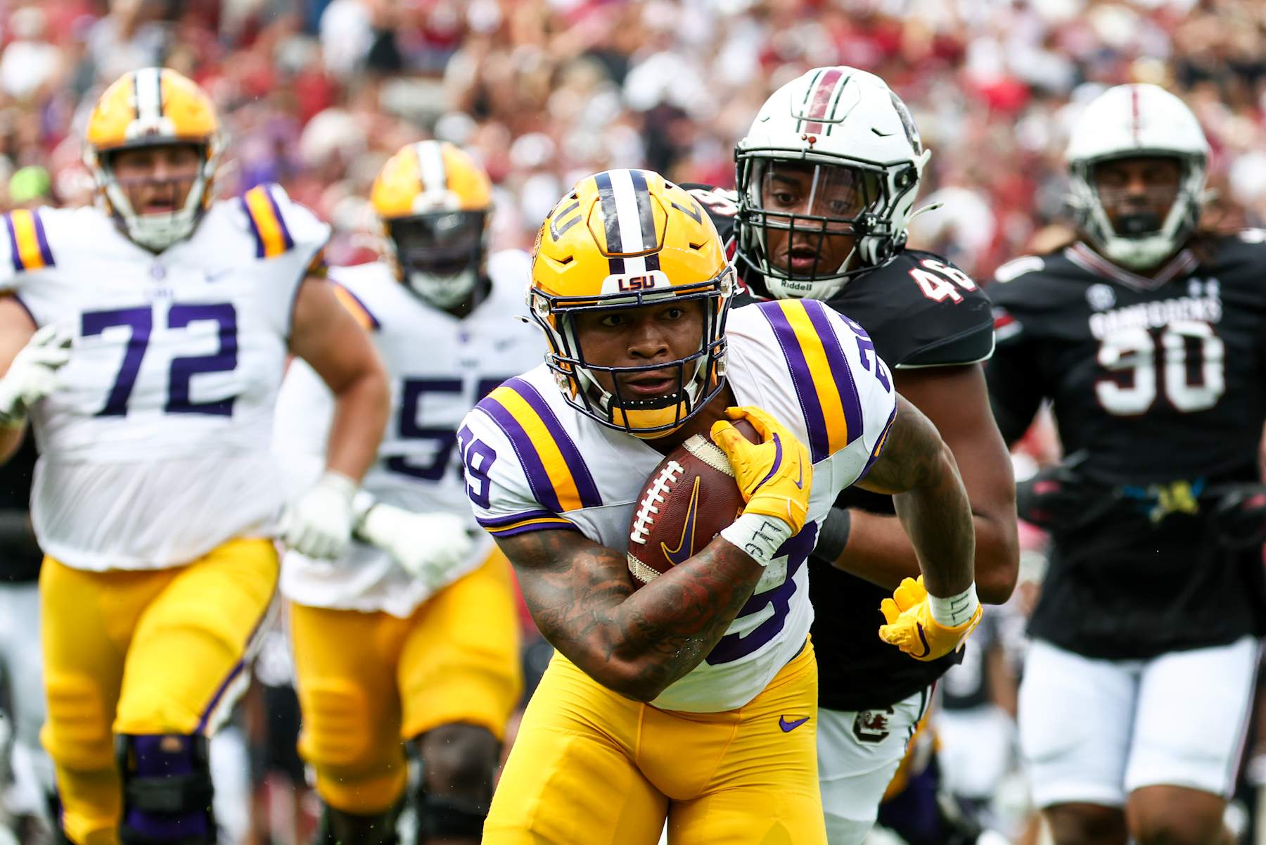 COLUMBIA, SOUTH CAROLINA - SEPTEMBER 14: Caden Durham #29 of LSU Tigers runs the ball against the South Carolina Gamecocks for a touchdown during the second quarter at Williams-Brice Stadium on September 14, 2024 in Columbia, South Carolina. (Photo by Isaiah Vazquez/Getty Images)
