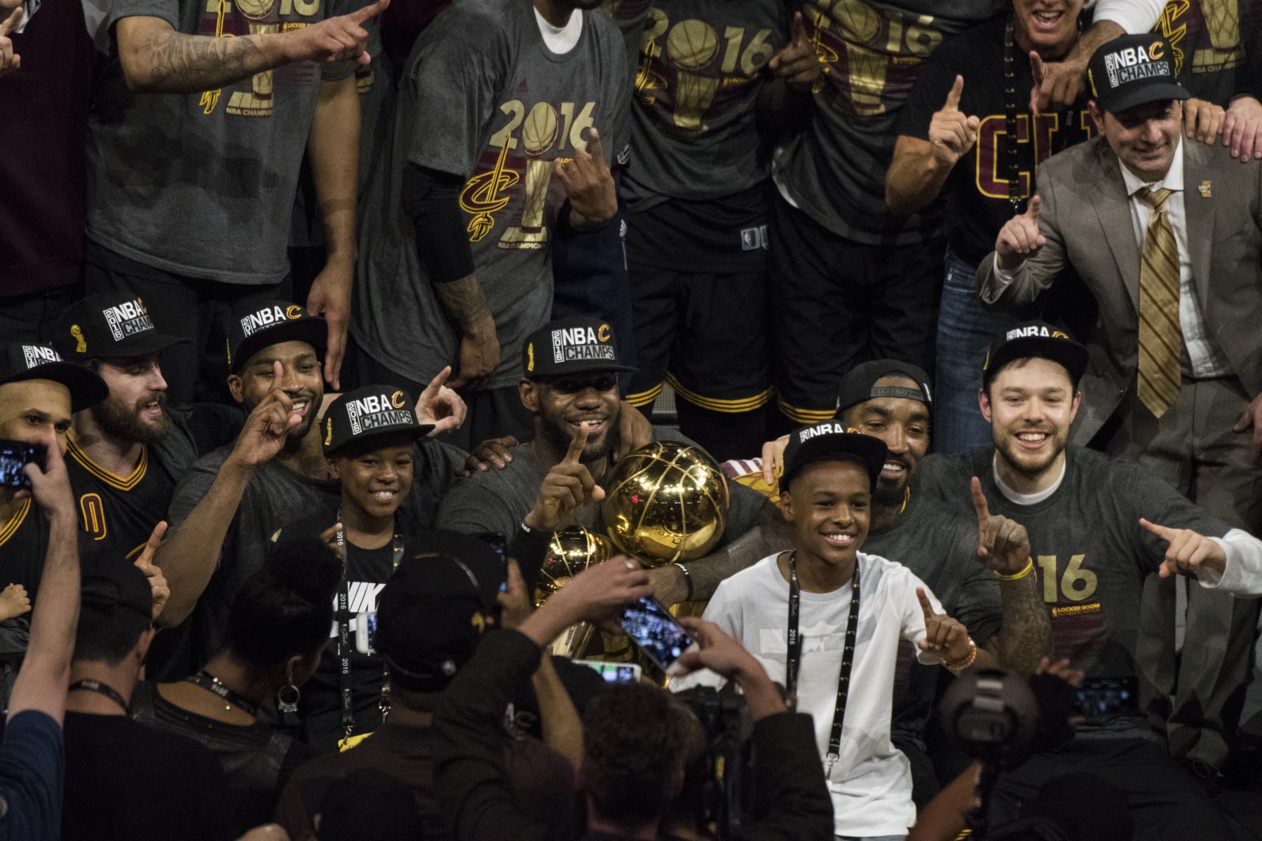Basketball: NBA Finals: Cleveland Cavaliers LeBron James (23) victorious holding Larry O'Brien and MVP trophies after winning series vs Golden State Warriors at Oracle Arena. Game 7. 
Oakland, CA 6/19/2016
CREDIT: John W. McDonough (Photo by John W. McDonough /Sports Illustrated via Getty Images)
(Set Number: SI146 TK1 )