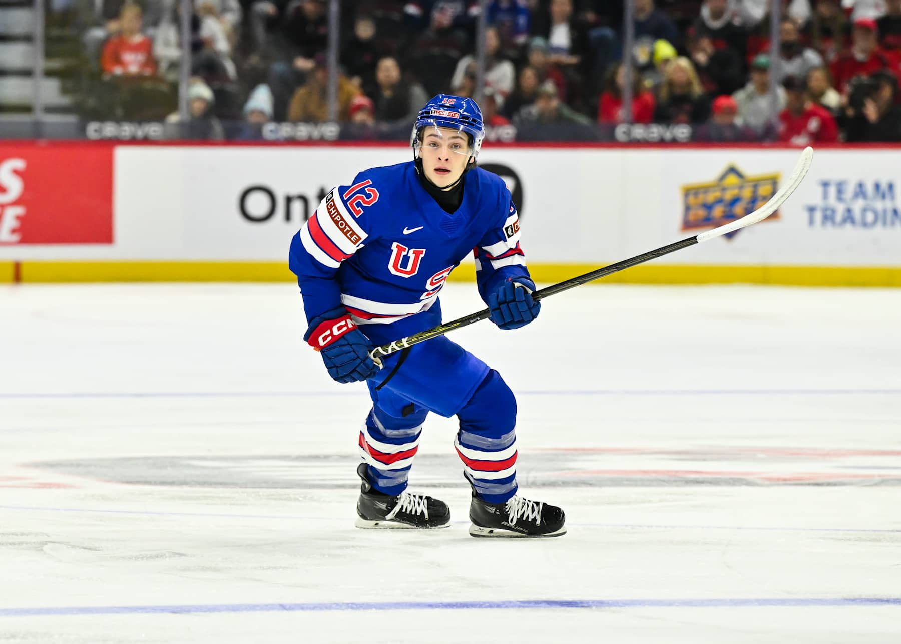OTTAWA, CANADA - DECEMBER 29:  James Hagens #12 of Team USA skates in the first period against Team Finland of the Group A match during the 2025 IIHF World Junior Championship at Canadian Tire Centre on December 29, 2024 in Ottawa, Ontario, Canada.  Team Finland defeated Team USA 4-3 in overtime.  (Photo by Minas Panagiotakis/Getty Images)