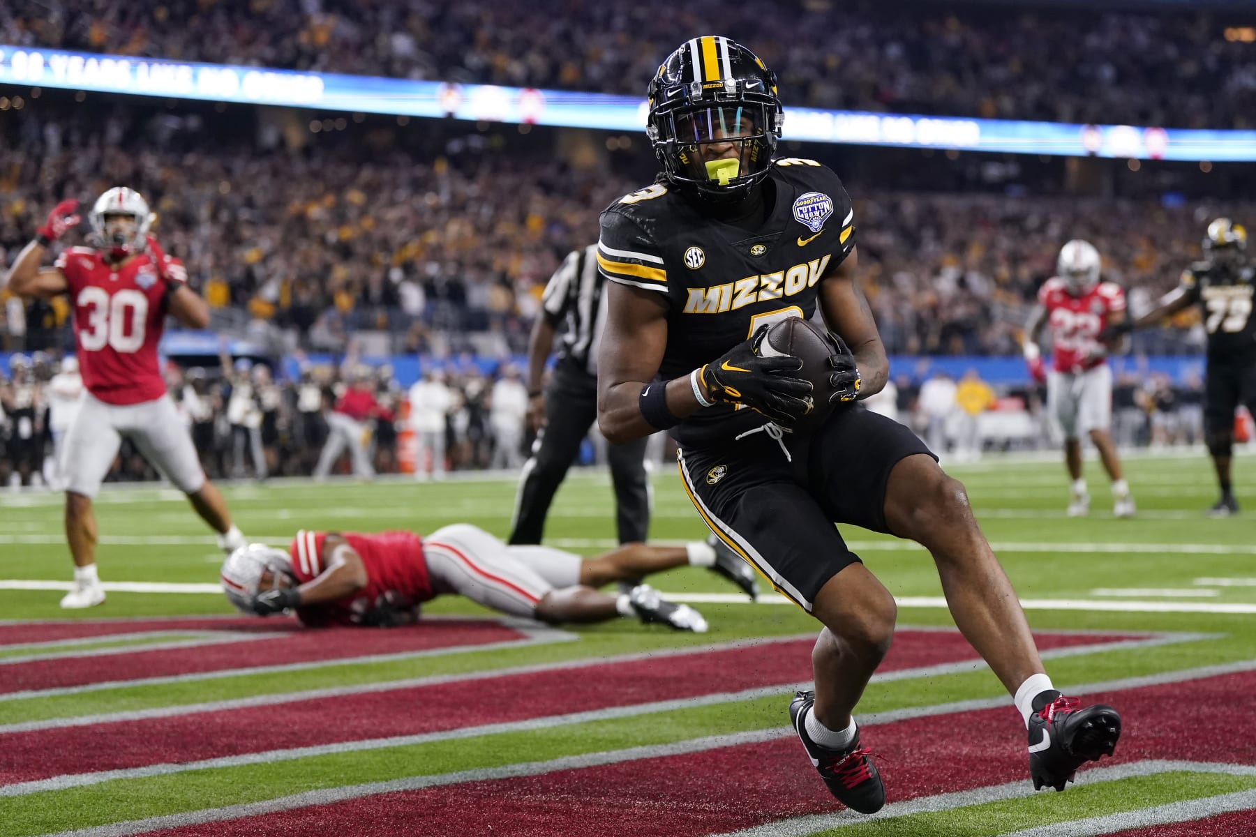 ARLINGTON, TEXAS - DECEMBER 29: Luther Burden III #3 of the Missouri Tigers catches a pass for a touchdown during the fourth quarter against the Ohio State Buckeyes in the Goodyear Cotton Bowl at AT&T Stadium on December 29, 2023 in Arlington, Texas. (Photo by Sam Hodde/Getty Images)