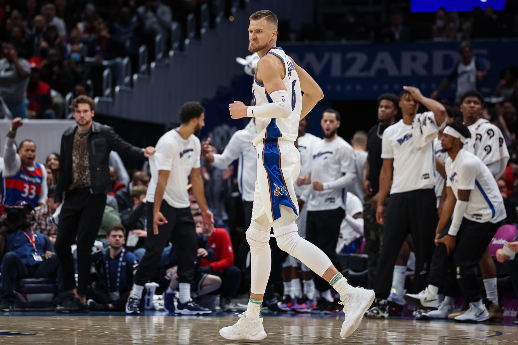 WASHINGTON, DC - OCTOBER 21: Kristaps Porzingis #6 of the Washington Wizards reacts after making a basket against the Chicago Bulls during the first half at Capital One Arena on October 21, 2022 in Washington, DC. NOTE TO USER: User expressly acknowledges and agrees that, by downloading and or using this photograph, User is consenting to the terms and conditions of the Getty Images License Agreement. (Photo by Scott Taetsch/Getty Images)