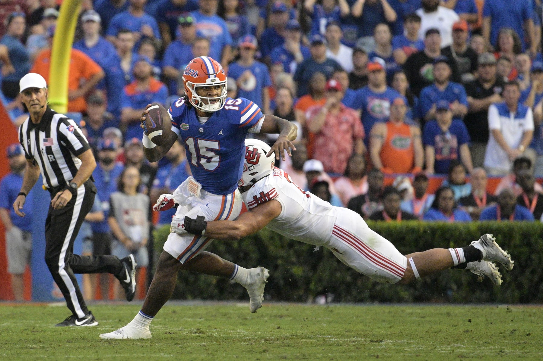 Florida quarterback Anthony Richardson (15) escapes from Utah defensive end Van Fillinger (7) during the first half of an NCAA college football game, Saturday, Sept. 3, 2022, in Gainesville, Fla. (AP Photo/Phelan M. Ebenhack)
