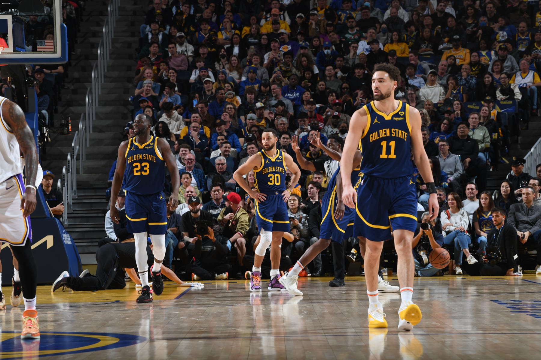 SAN FRANCISCO, CA - JANUARY 27: Draymond Green #23, Stephen Curry #30 and Klay Thompson #11 of the Golden State Warriors stand on the court during the game against the Los Angeles Lakers on January 27, 2024 at Chase Center in San Francisco, California. NOTE TO USER: User expressly acknowledges and agrees that, by downloading and or using this photograph, user is consenting to the terms and conditions of Getty Images License Agreement. Mandatory Copyright Notice: Copyright 2024 NBAE (Photo by Noah Graham/NBAE via Getty Images)