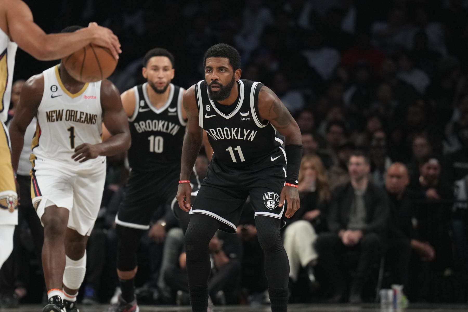 BROOKLYN, NY - OCTOBER 19: Kyrie Irving #11 of the Brooklyn Nets looks on during the game against the New Orleans Pelicans on October 19, 2022 at Barclays Center in Brooklyn, New York. NOTE TO USER: User expressly acknowledges and agrees that, by downloading and or using this Photograph, user is consenting to the terms and conditions of the Getty Images License Agreement. Mandatory Copyright Notice: Copyright 2022 NBAE (Photo by Jesse D. Garrabrant/NBAE via Getty Images)