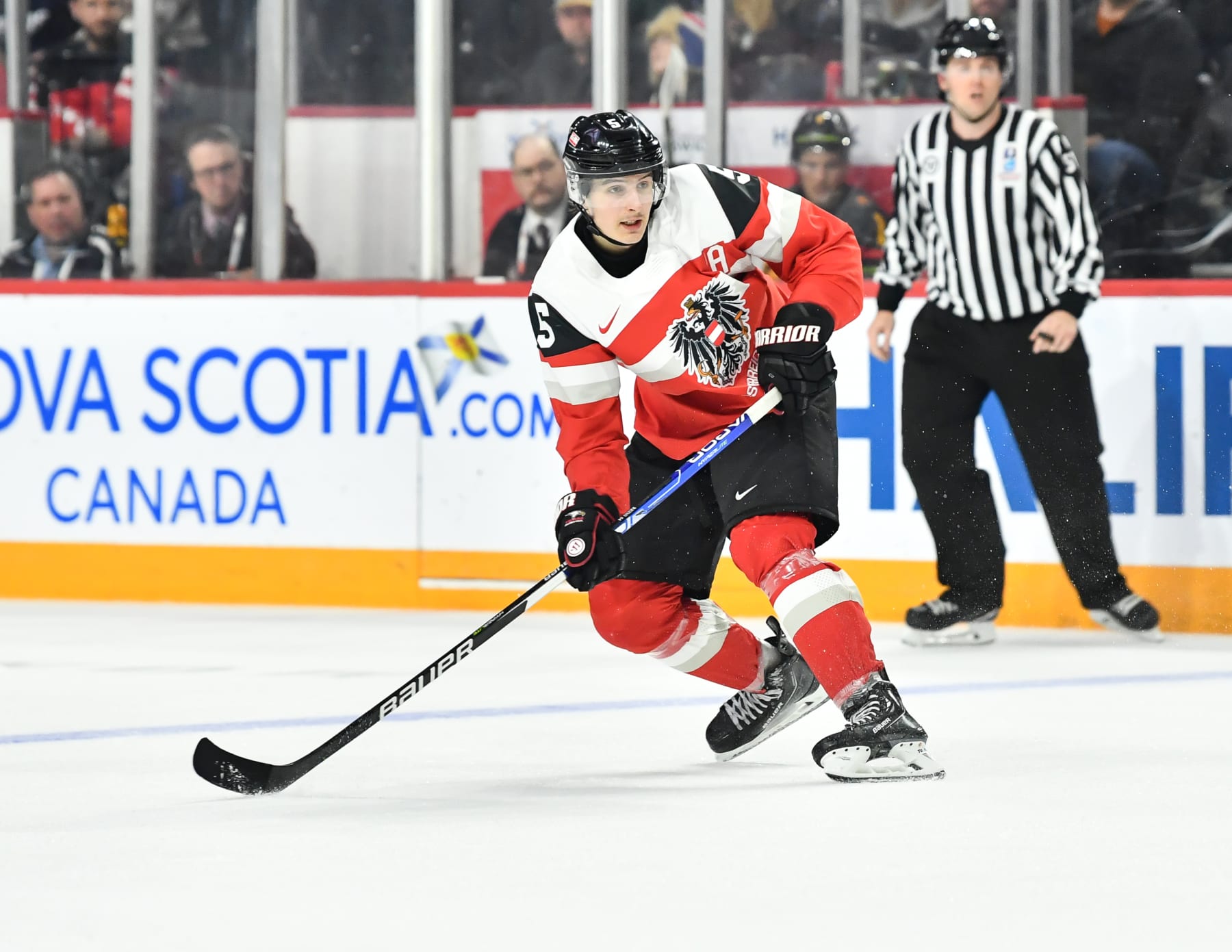 HALIFAX, CANADA - DECEMBER 30:  David Reinbacher #5 of Team Austria skates against Team Germany during the third period in the 2023 IIHF World Junior Championship at Scotiabank Centre on December 30, 2022 in Halifax, Nova Scotia, Canada.  Team Germany defeated Team Austria 4-2.  (Photo by Minas Panagiotakis/Getty Images)
