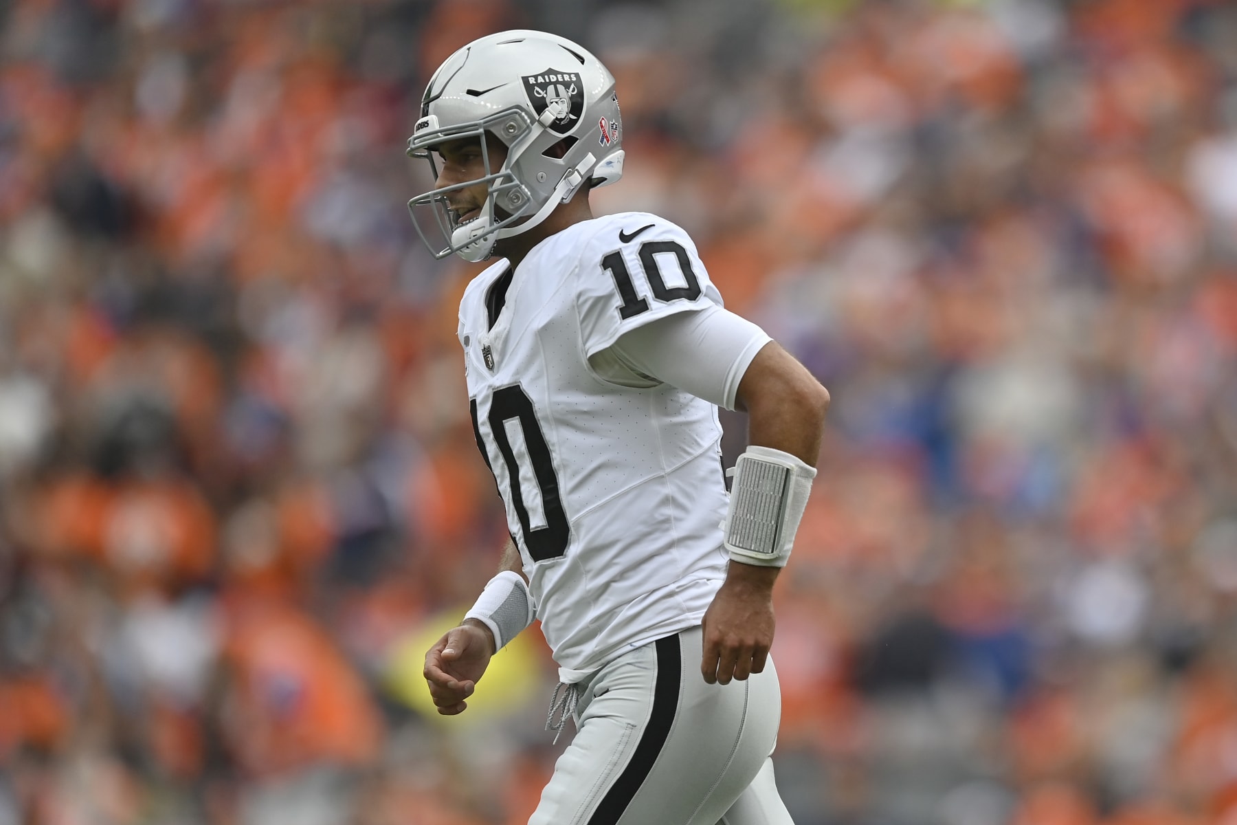 DENVER, COLORADO - SEPTEMBER 10: Jimmy Garoppolo #10 of the Las Vegas Raiders reacts after throwing a touchdown pass during the first quarter against the Denver Broncos at Empower Field At Mile High on September 10, 2023 in Denver, Colorado. (Photo by Dustin Bradford/Getty Images)