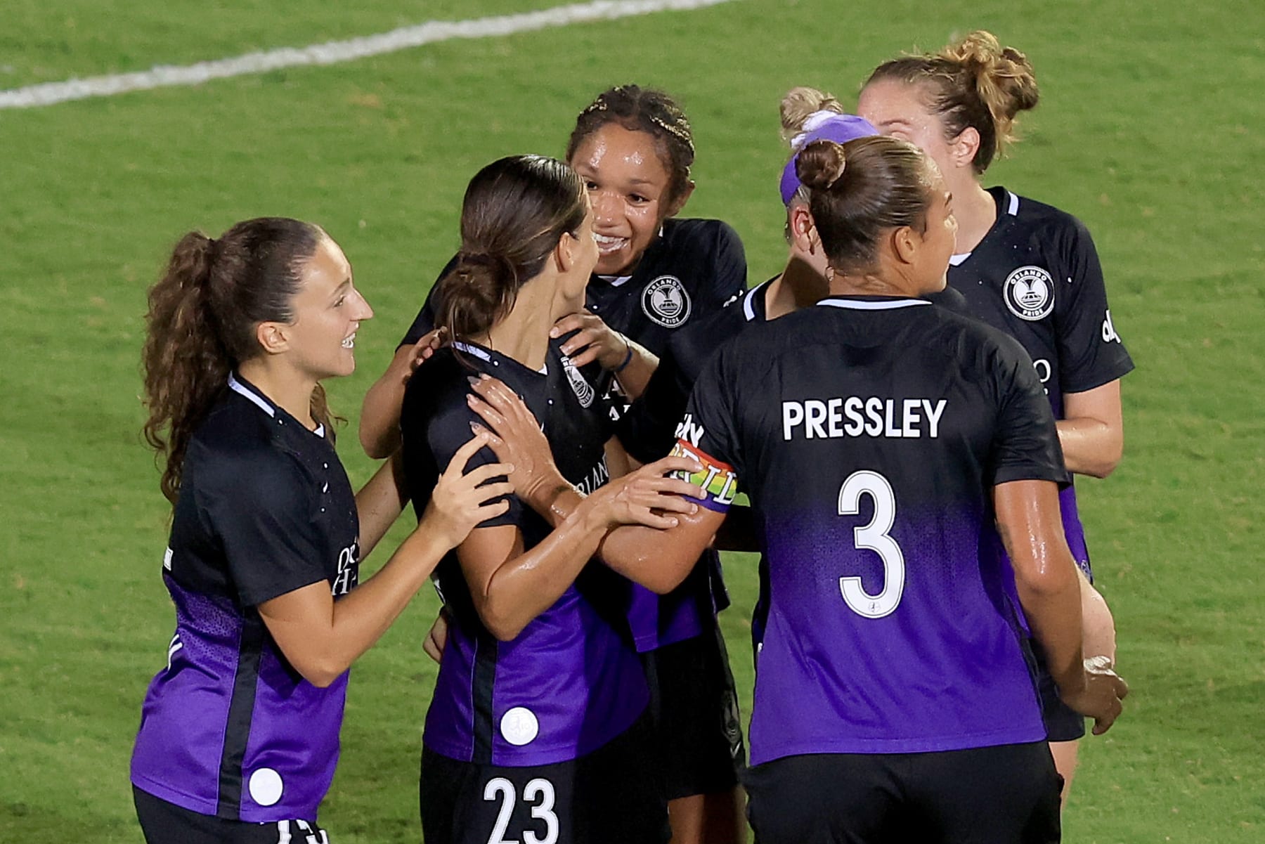 DAYTONA BEACH, FLORIDA - JULY 03: Orlando Pride players celebrate a goal against the Racing Louisville FC during the Daytona Soccer Fest at Daytona International Speedway on July 03, 2022 in Daytona Beach, Florida. (Photo by Sam Greenwood/Getty Images)