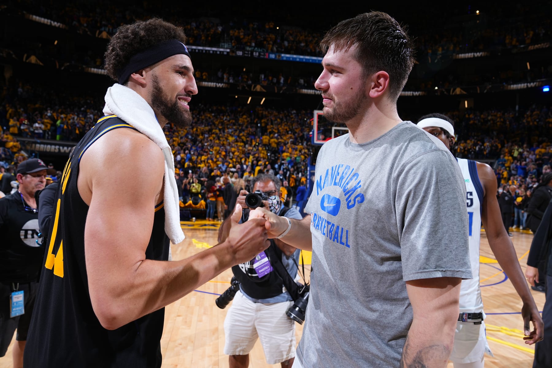 SAN FRANCISCO, CA - MAY 26: Klay Thompson #11 of the Golden State Warriors and Luka Doncic #77 of the Dallas Mavericks embrace after Game 5 of the 2022 NBA Playoffs Western Conference Finals on May 26, 2022 at Chase Center in San Francisco, California. NOTE TO USER: User expressly acknowledges and agrees that, by downloading and or using this photograph, user is consenting to the terms and conditions of Getty Images License Agreement. Mandatory Copyright Notice: Copyright 2022 NBAE (Photo by Garrett Ellwood/NBAE via Getty Images)
