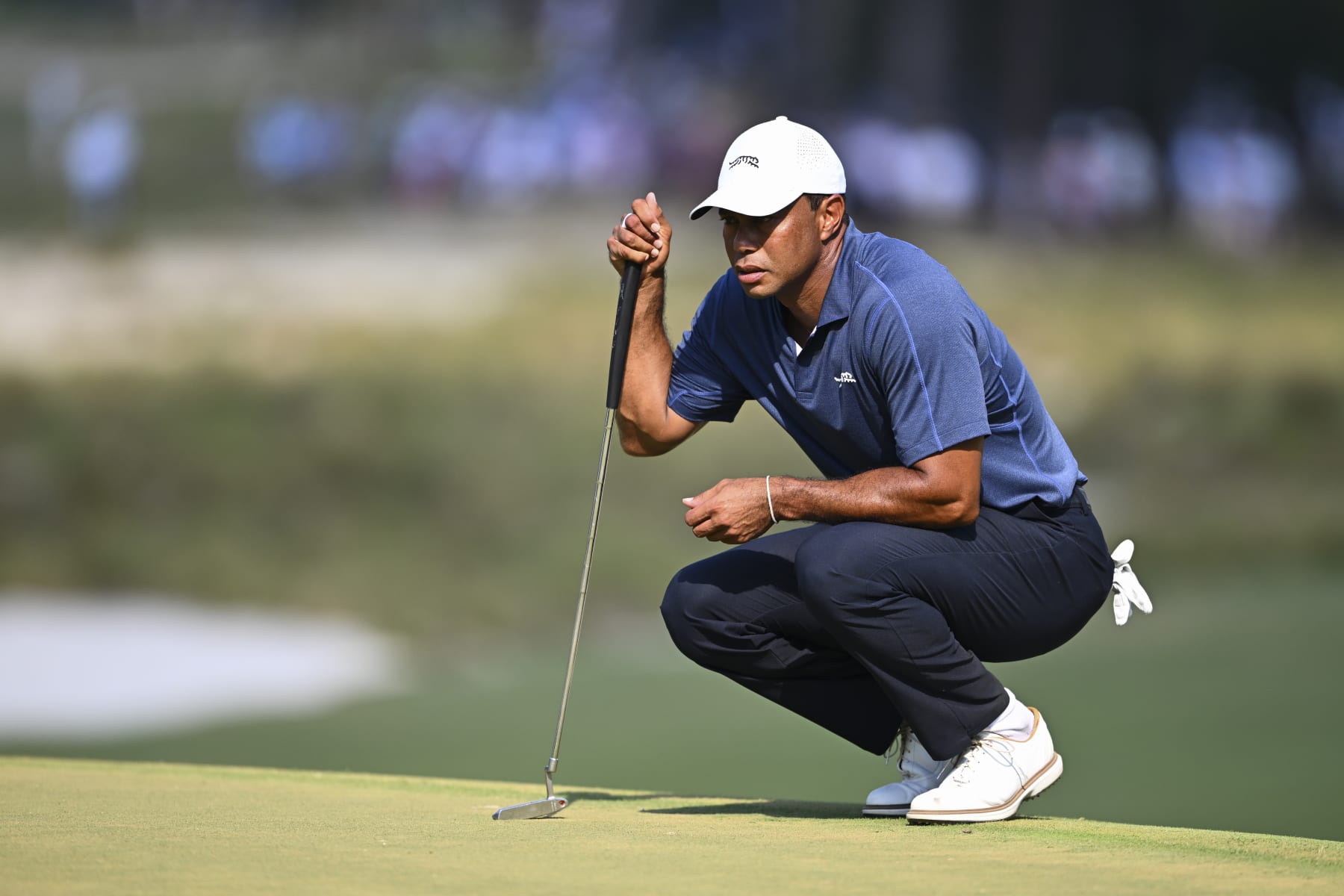 PINEHURST, NORTH CAROLINA - JUNE 14: Tiger Woods lines up his putt at the 13th green during the second round of 124th U.S. Open Championship at Pinehurst No. 2 at Pinehurst Resort on June 14, 2024 in Pinehurst, North Carolina. (Photo by Tracy Wilcox/PGA TOUR via Getty Images)