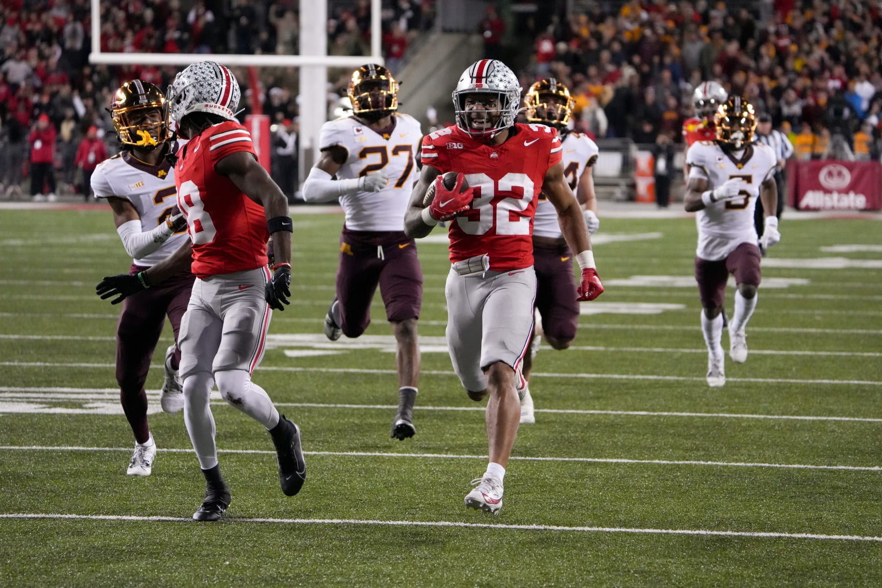 COLUMBUS, OHIO - NOVEMBER 18: Running back TreVeyon Henderson #32 of the Ohio State Buckeyes carries the ball during the third quarter against the Minnesota Golden Gophersat Ohio Stadium on November 18, 2023 in Columbus, Ohio. (Photo by Jason Mowry/Getty Images)