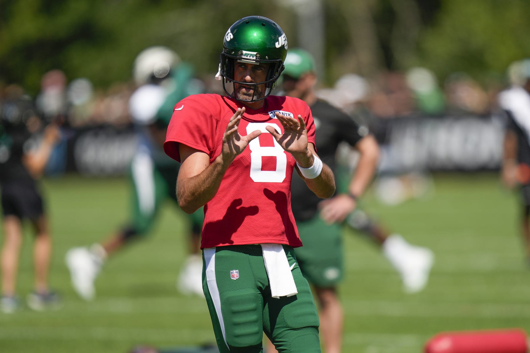 New York Jets quarterback Aaron Rodgers participates in a drill during a practice at the NFL football team's training facility in Florham Park, N.J., Sunday, July 30, 2023. (AP Photo/Seth Wenig)