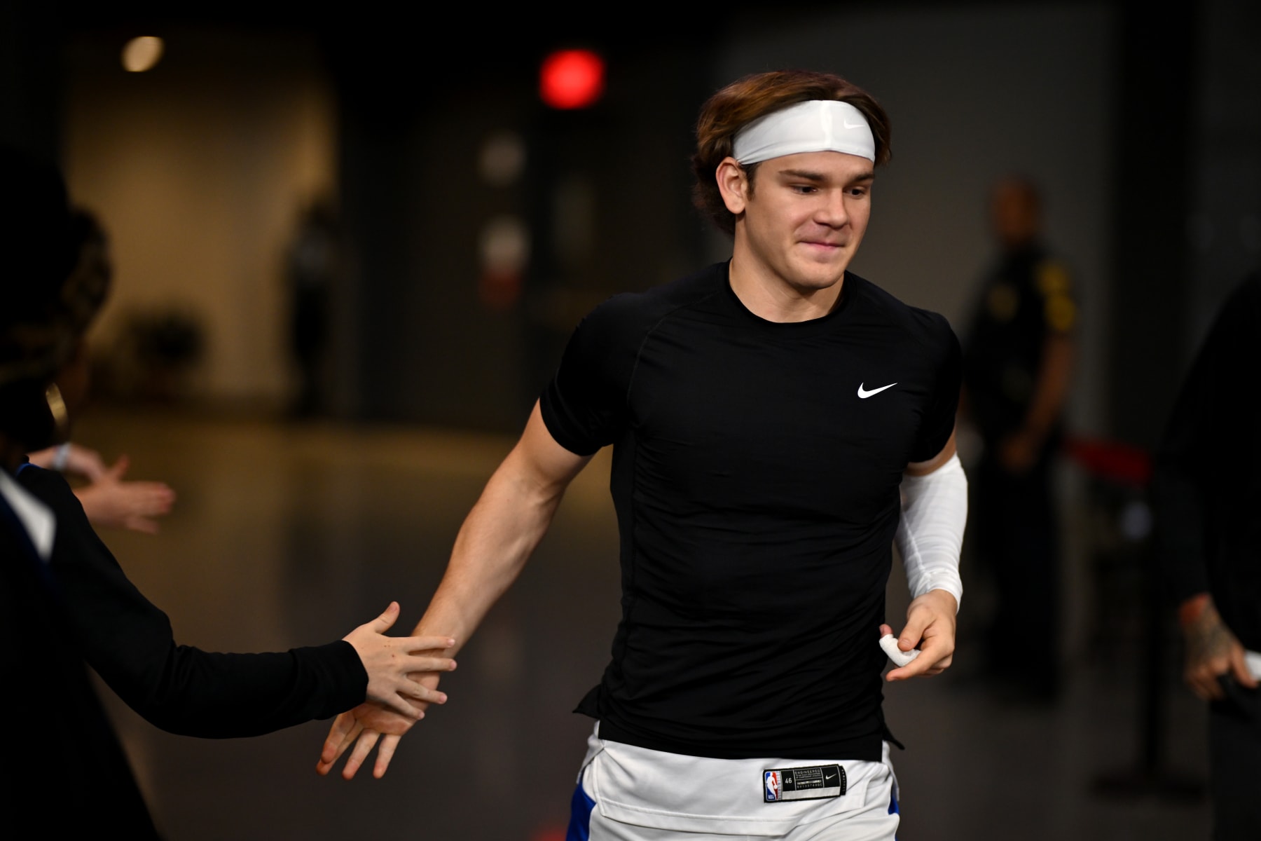 COLLEGE PARK, GA - March 08: Mac McClung #0 of the Osceola Magic shakes a fans hands as he comes out the tunnel before the game against the College Park Skyhawks at Gateway Center Arena on February 10, 2024 NOTE TO USER: User expressly acknowledges and agrees that, by downloading and or using this photograph, user is consenting to the terms and conditions of Getty Images License Agreement. Mandatory Copyright Notice: Copyright 2024 NBAE (Photo by Derek White/NBAE via Getty Images)
