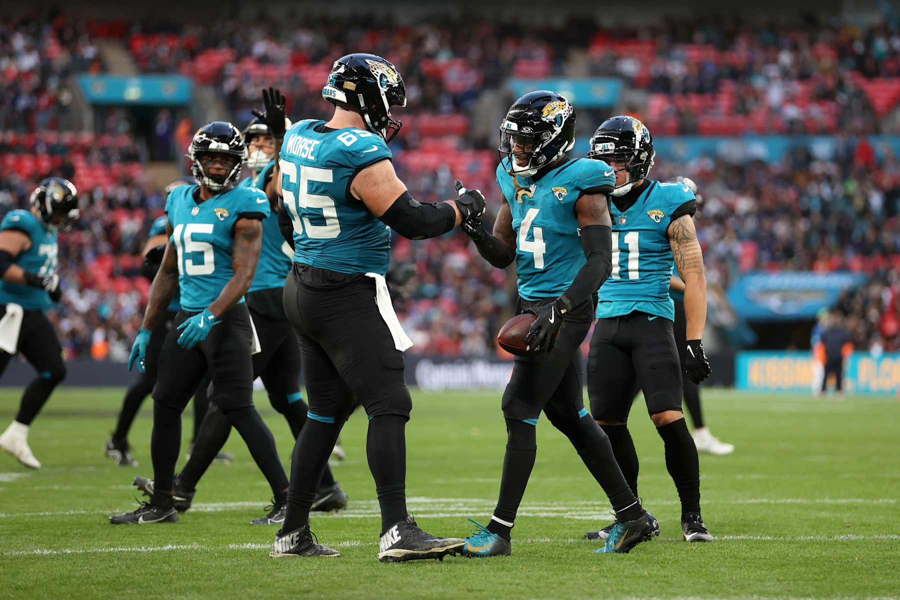 LONDON, ENGLAND - OCTOBER 20: Tank Bigsby of Jacksonville Jaguars celebrates a touch down with teammate Andre Cisco of Jacksonville Jaguars during the NFL match between New England Patriots and Jacksonville Jaguars at Wembley Stadium on October 20, 2024 in London, England. (Photo by Julian Finney/Getty Images)