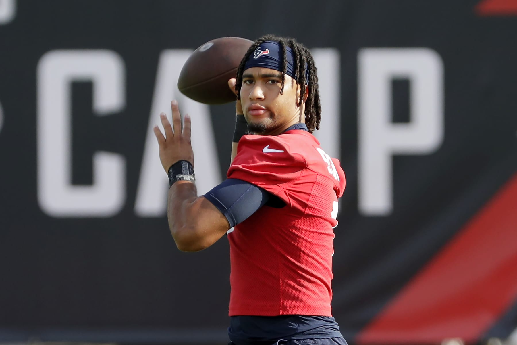 Houston Texans quarterback C.J. Stroud warms up during the NFL football team's training camp, Sunday, July 30, 2023, in Houston. (AP Photo/Michael Wyke)