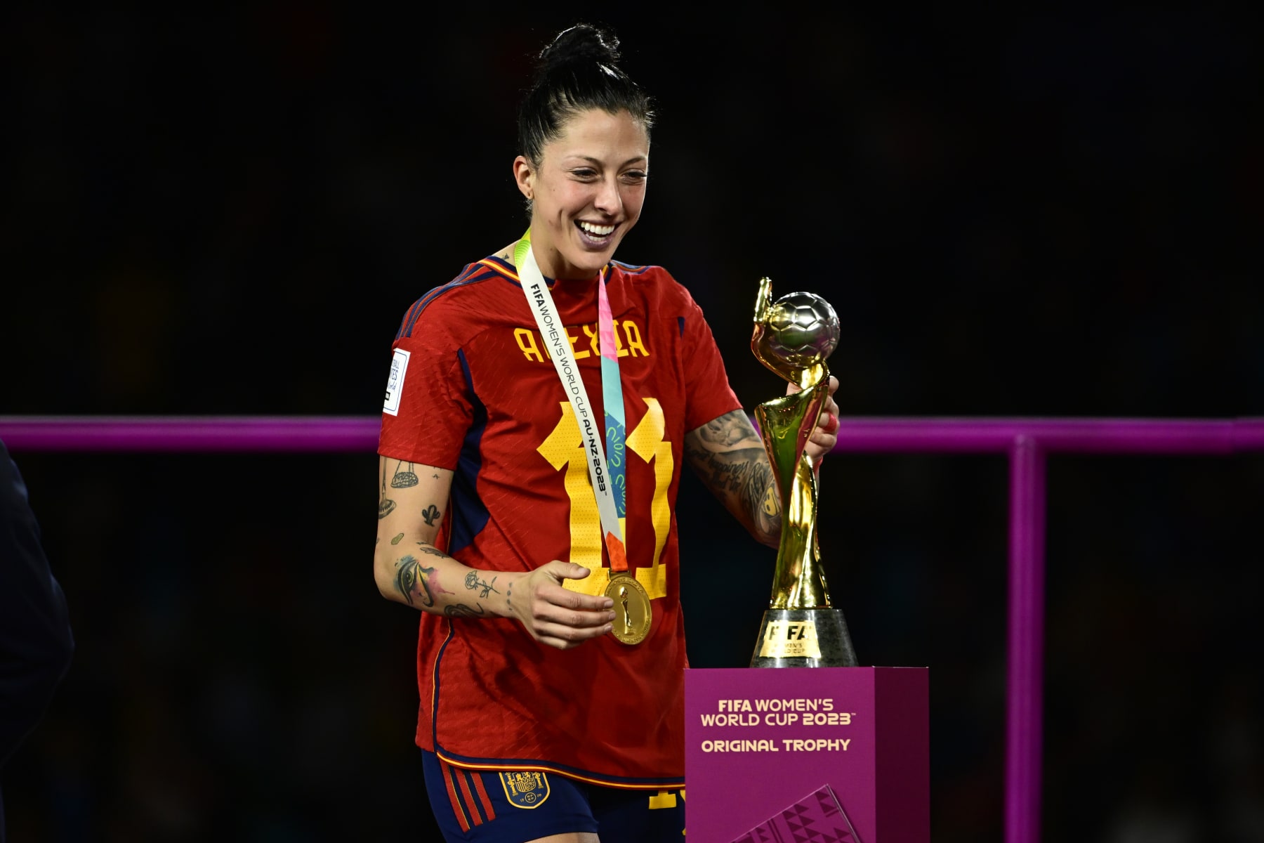 SYDNEY, AUSTRALIA - AUGUST 20: Jennifer Hermoso of Spain smiles as she touches the world cup trophy after the FIFA Women's World Cup Australia & New Zealand 2023 Final match between Spain and England at Stadium Australia on August 20, 2023 in Sydney, Australia. (Photo by Richard Callis/MB Media/Getty Images)