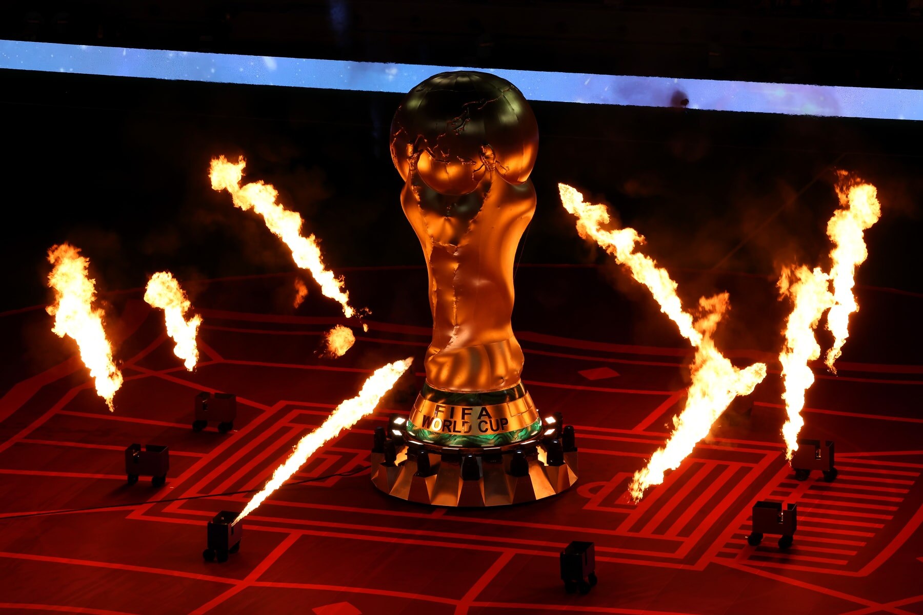 AL KHOR, QATAR - NOVEMBER 29: Pyrotechnics surround a giant FIFA World Cup trophy prior to the FIFA World Cup Qatar 2022 Group A match between Netherlands and Qatar at Al Bayt Stadium on November 29, 2022 in Al Khor, Qatar. (Photo by Mohamed Farag/Getty Images)