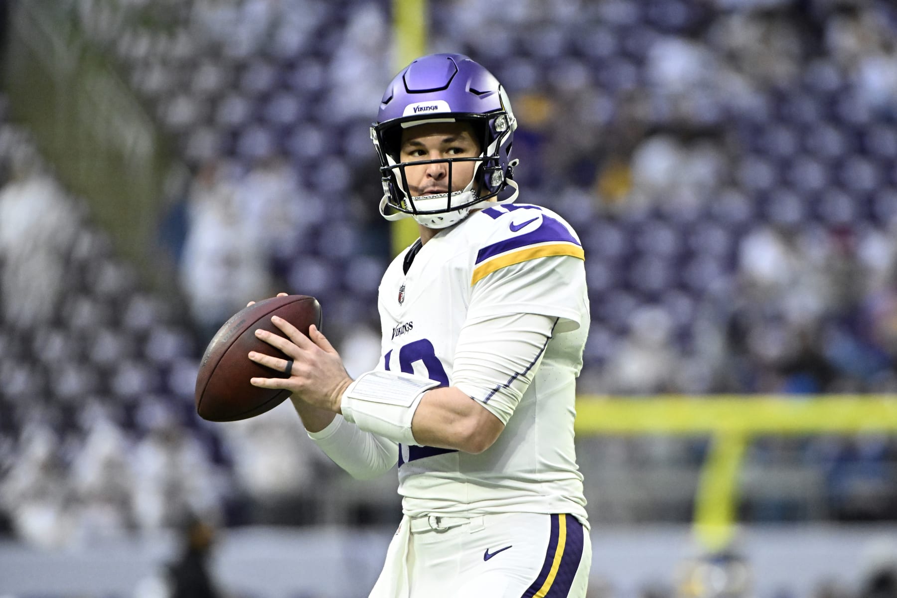 MINNEAPOLIS, MINNESOTA - DECEMBER 24:  Nick Mullens #12 of the Minnesota Vikings warms up prior to the game against the Detroit Lions at U.S. Bank Stadium on December 24, 2023 in Minneapolis, Minnesota. (Photo by Stephen Maturen/Getty Images)