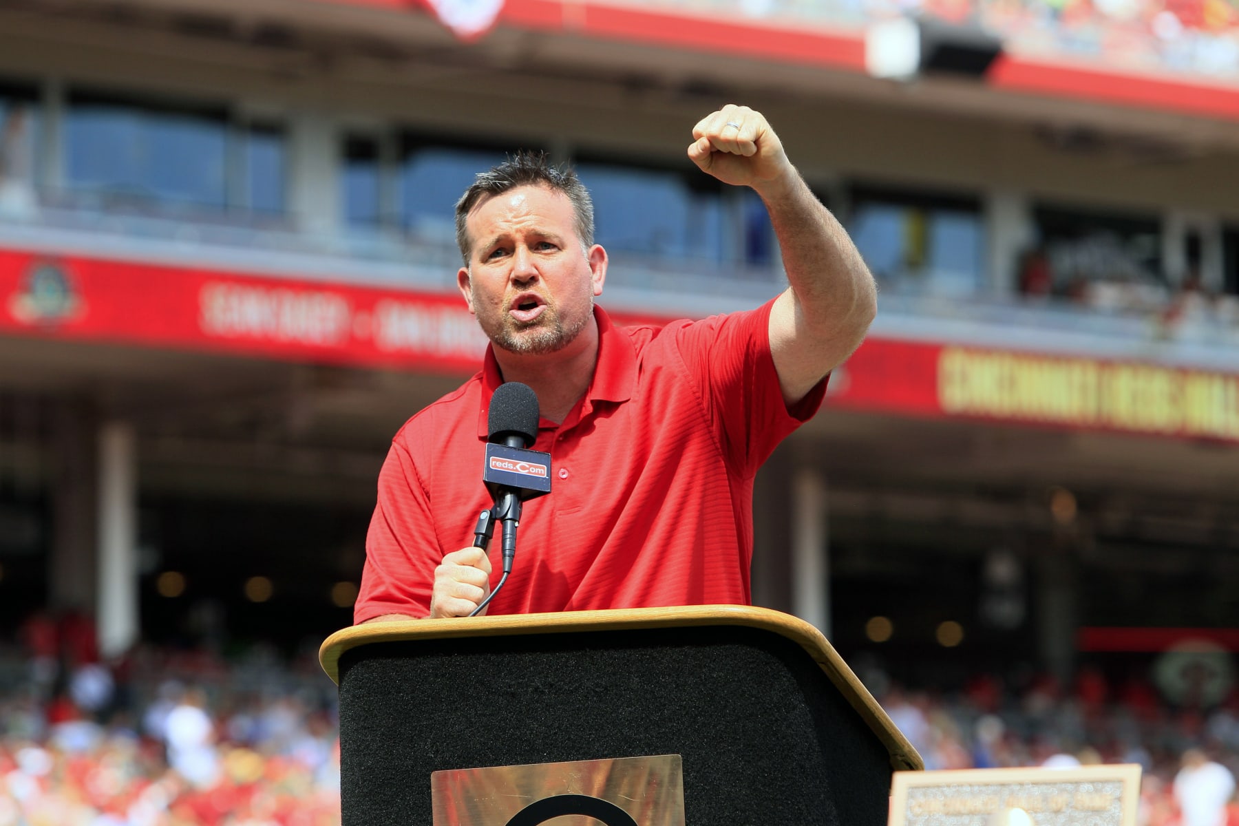 FILE - Former Cincinnati Reds first baseman Sean Casey speaks during ceremonies enshrining him into the team's Hall of Fame prior to a baseball game between the Cincinnati Reds and the Minnesota Twins, Saturday, June 23, 2012, in Cincinnati. The New York Yankees have hired 12-year big league veteran Sean Casey as their hitting coach for the remainder of this season, a person with knowledge of the situation told The Associated Press. The person spoke to the AP on condition of anonymity because the deal has not been formally announced. Casey, 49, has been working for MLB Network as an analyst.(AP Photo/Al Behrman, FIle)