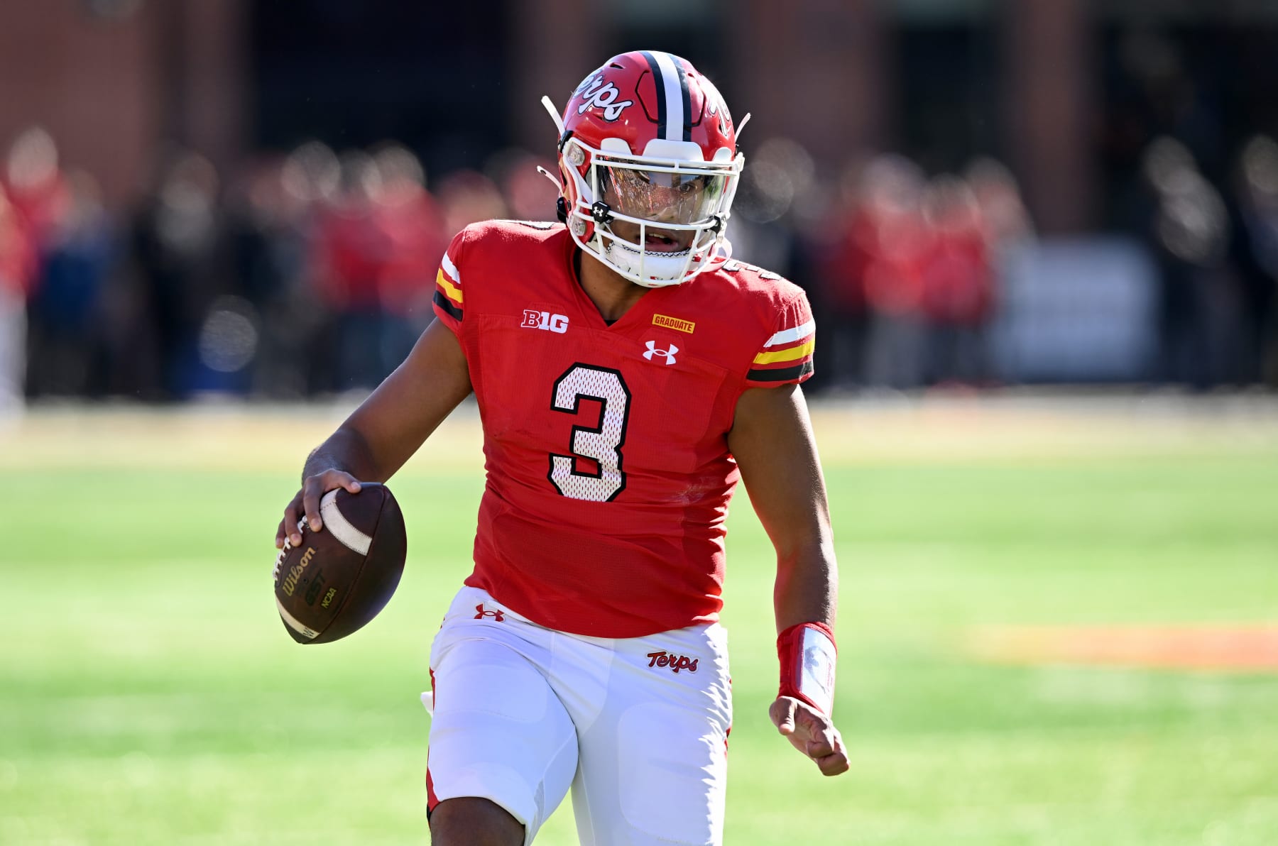 COLLEGE PARK, MARYLAND - NOVEMBER 18: Taulia Tagovailoa #3 of the Maryland Terrapins rolls out of the pocket against the Michigan Wolverines at SECU Stadium on November 18, 2023 in College Park, Maryland. (Photo by G Fiume/Getty Images)