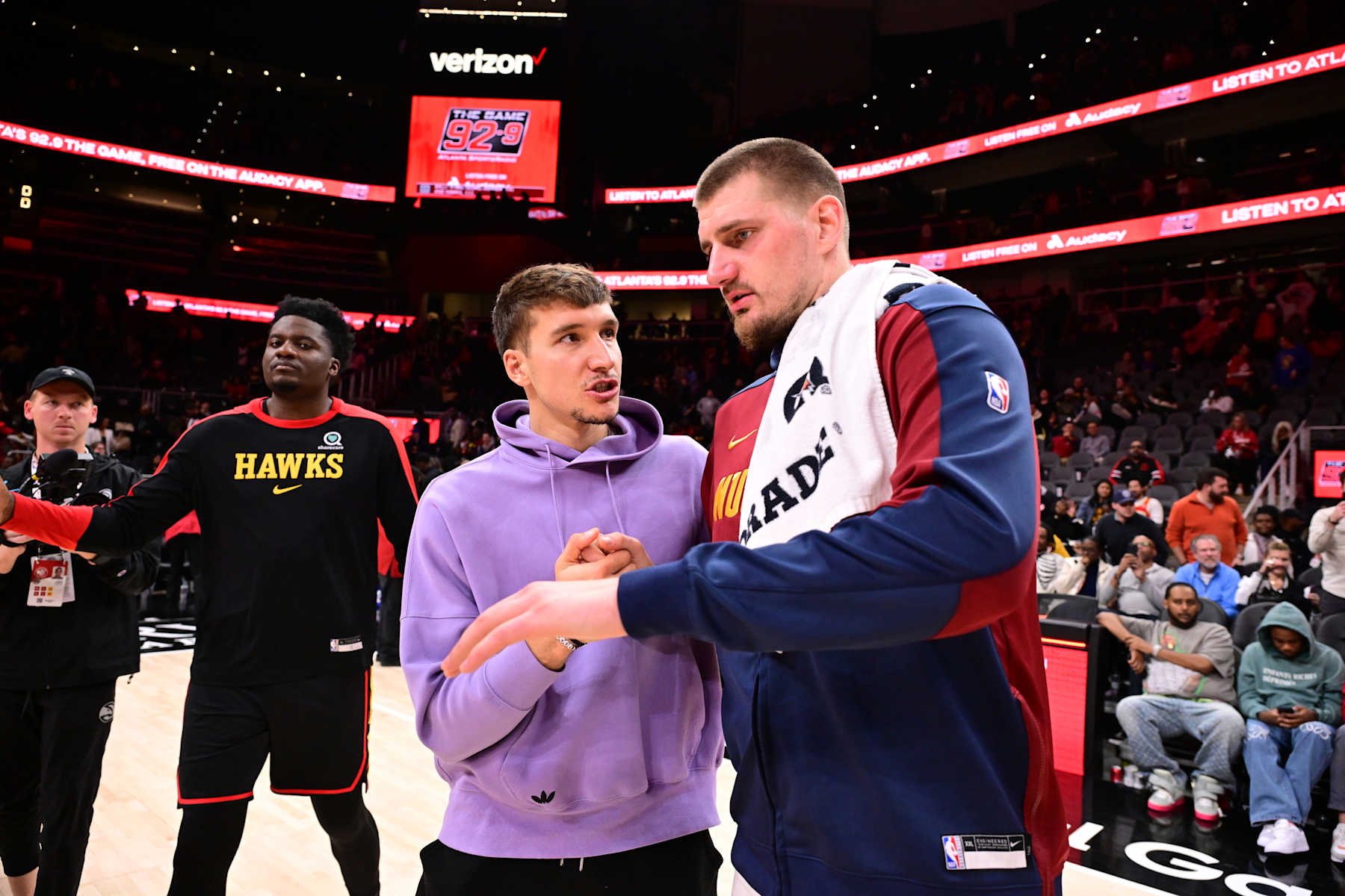 ATLANTA, GA - DECEMBER 8: Nikola Jokic #15 of the Denver Nuggets and Bogdan Bogdanovic #13 of the Atlanta Hawks talk after the game on December 8, 2024 at State Farm Arena in Atlanta, Georgia.  NOTE TO USER: User expressly acknowledges and agrees that, by downloading and/or using this Photograph, user is consenting to the terms and conditions of the Getty Images License Agreement. Mandatory Copyright Notice: Copyright 2024 NBAE (Photo by Adam Hagy/NBAE via Getty Images)