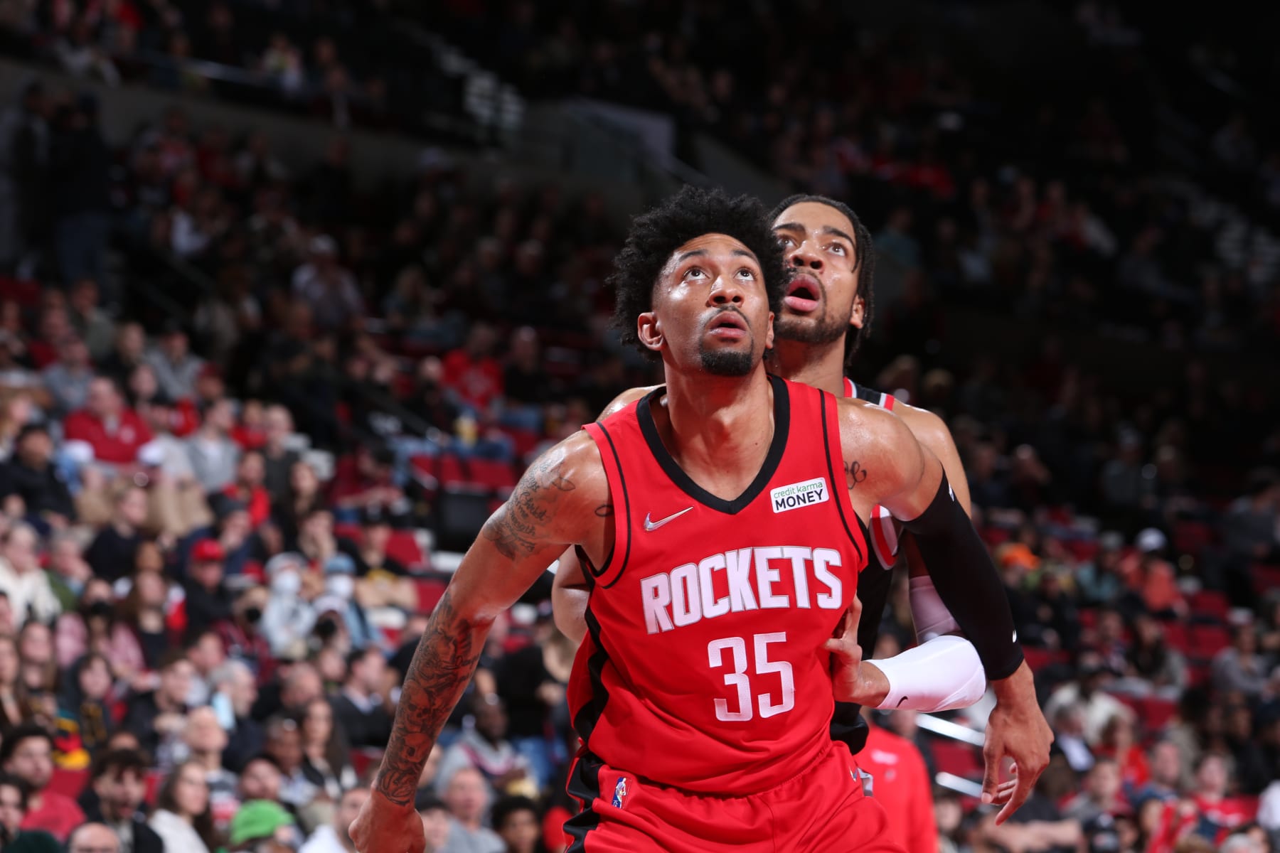 PORTLAND, OR - MARCH 26: Christian Wood #35 of the Houston Rockets looks for the rebound during the game against the Portland Trail Blazers on March 26, 2022 at the Moda Center Arena in Portland, Oregon. NOTE TO USER: User expressly acknowledges and agrees that, by downloading and or using this photograph, user is consenting to the terms and conditions of the Getty Images License Agreement. Mandatory Copyright Notice: Copyright 2022 NBAE (Photo by Sam Forencich/NBAE via Getty Images)