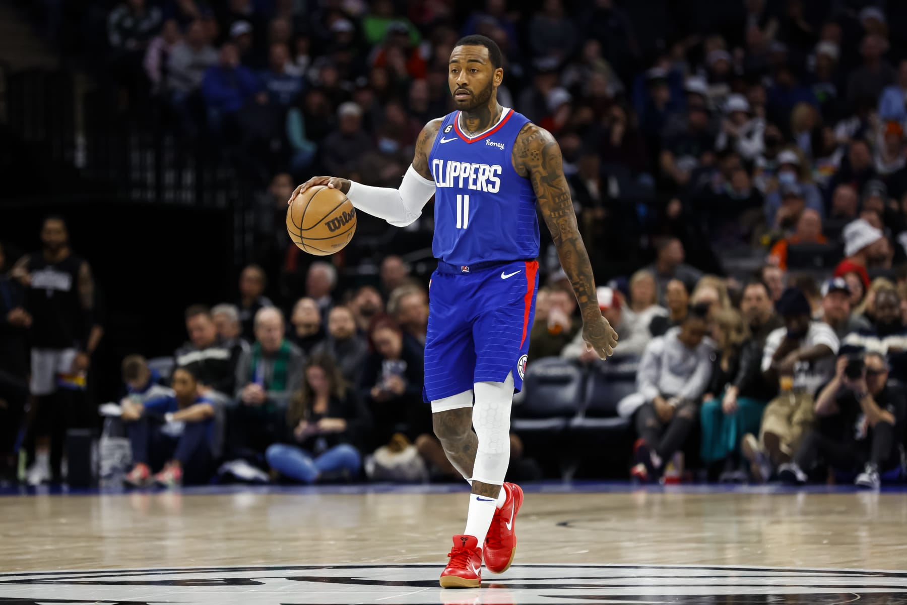 MINNEAPOLIS, MN - JANUARY 06: John Wall #11 of the LA Clippers dribbles the ball through center court against the Minnesota Timberwolves in the third quarter of the game at Target Center on January 6, 2023 in Minneapolis, Minnesota. The Timberwolves defeated the Clippers 128-115. NOTE TO USER: User expressly acknowledges and agrees that, by downloading and or using this Photograph, user is consenting to the terms and conditions of the Getty Images License Agreement. (Photo by David Berding/Getty Images)