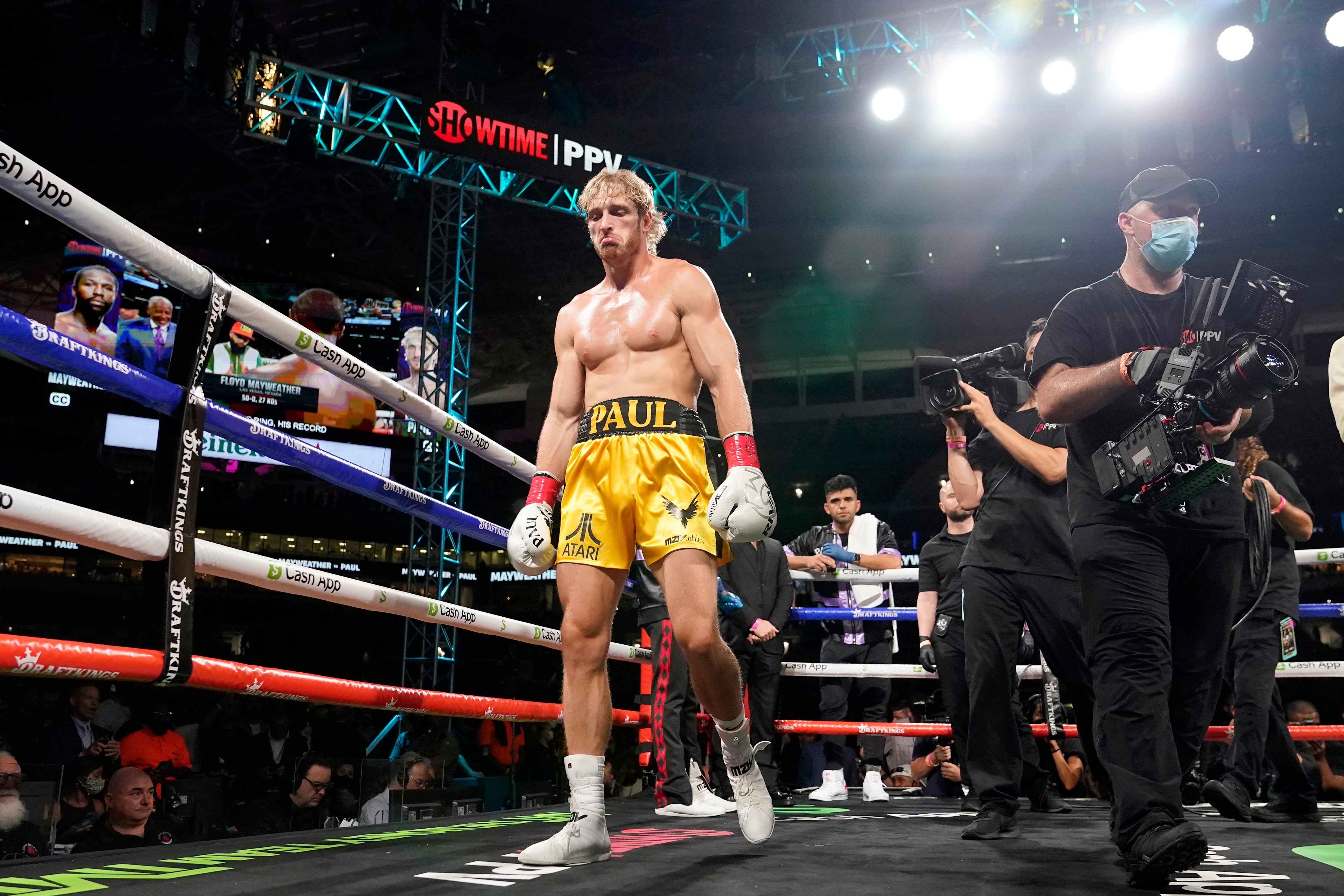 Logan Paul walks into the ring before an exhibition boxing match against Floyd Mayweather at Hard Rock Stadium, Sunday, June 6, 2021, in Miami Gardens, Fla. (AP Photo/Lynne Sladky)