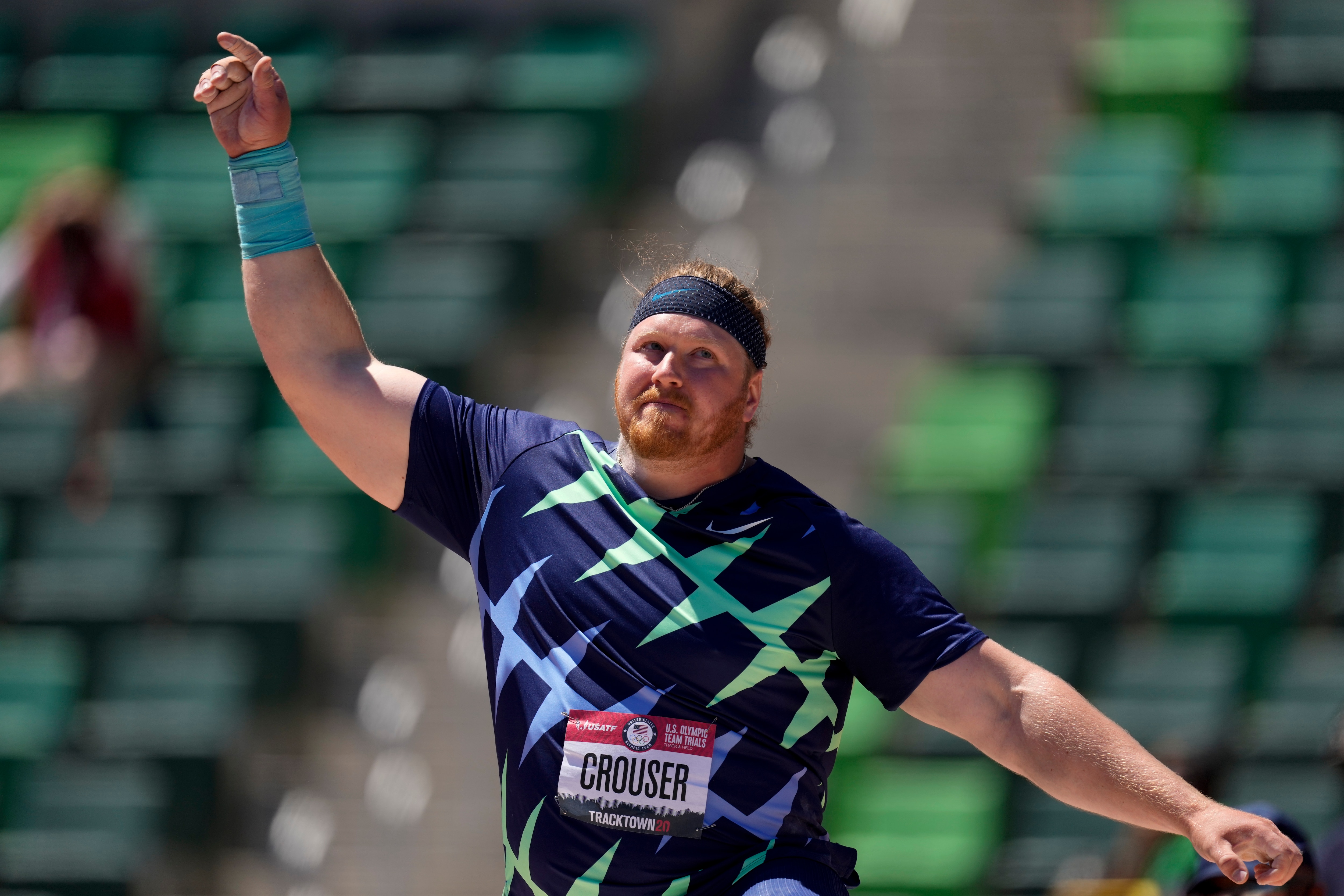 Ryan Crouser celebrates during the prelims of men's shot put at the U.S. Olympic Track and Field Trials Friday, June 18, 2021, in Eugene, Ore. (AP Photo/Charlie Riedel)