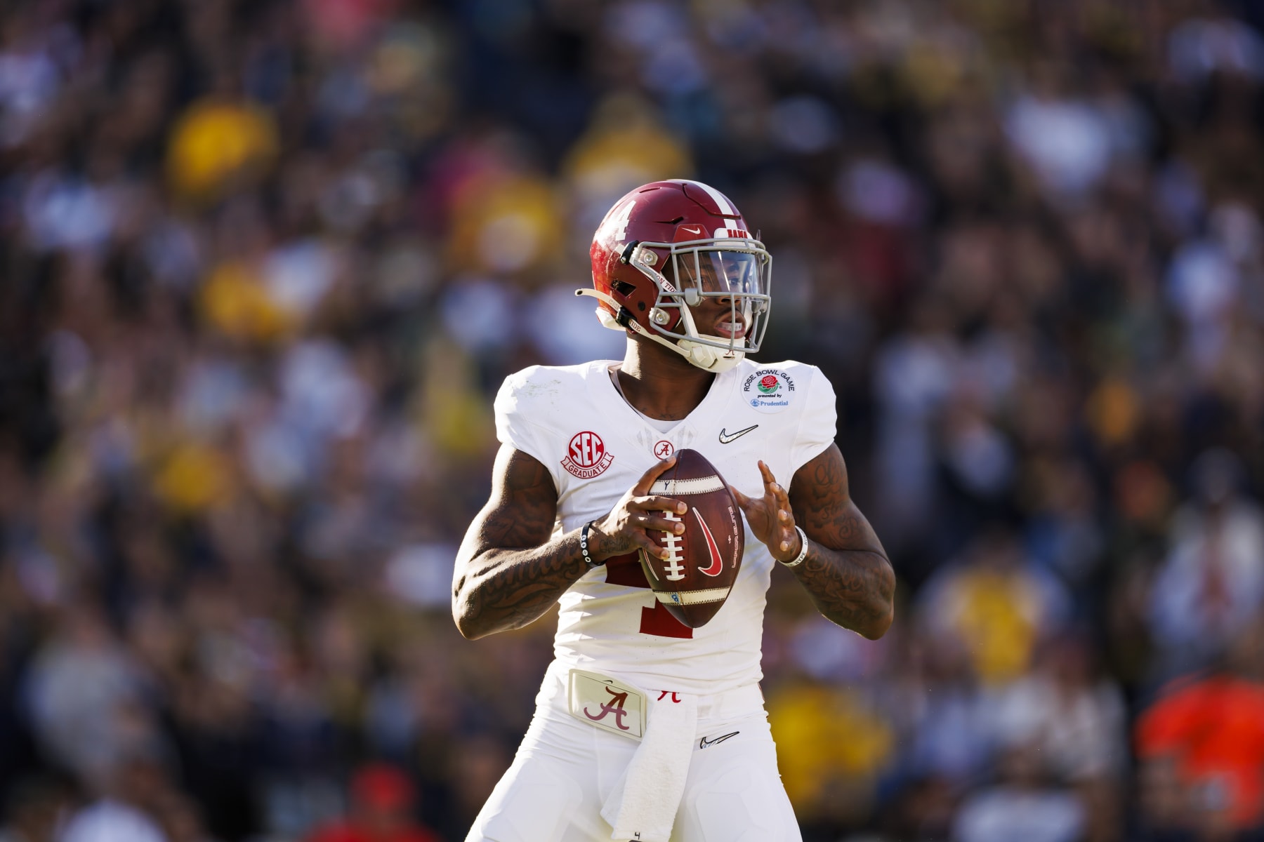 PASADENA, CALIFORNIA - JANUARY 01: Quarterback Jalen Milroe #4 of the Alabama Crimson Tide drops back and looks to throw a pass during the CFP Semifinal Rose Bowl Game against the Michigan Wolverines at Rose Bowl Stadium on January 1, 2024 in Pasadena, California. (Photo by Ryan Kang/Getty Images)
