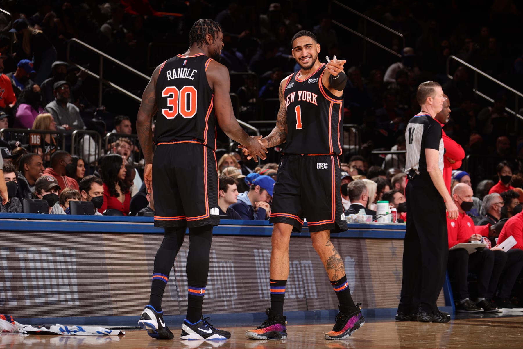 NEW YORK, NY - DECEMBER 25: Julius Randle #30 hi-fives Obi Toppin #1 of the New York Knicks during the game against the Atlanta Hawks on December 25, 2021 at Madison Square Garden in New York City, New York.  NOTE TO USER: User expressly acknowledges and agrees that, by downloading and or using this photograph, User is consenting to the terms and conditions of the Getty Images License Agreement. Mandatory Copyright Notice: Copyright 2021 NBAE  (Photo by Nathaniel S. Butler/NBAE via Getty Images)