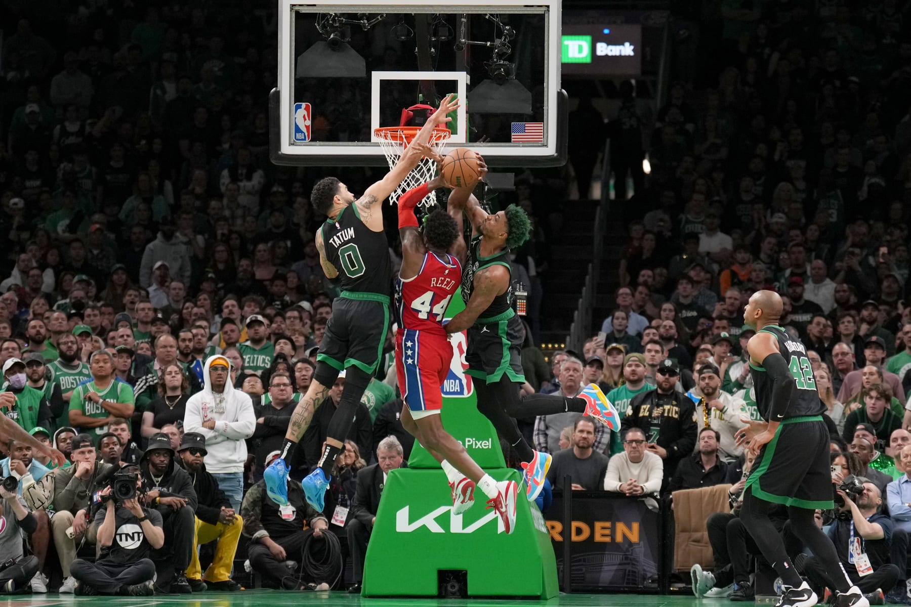 Jayson Tatum, Paul Reed and Marcus Smart