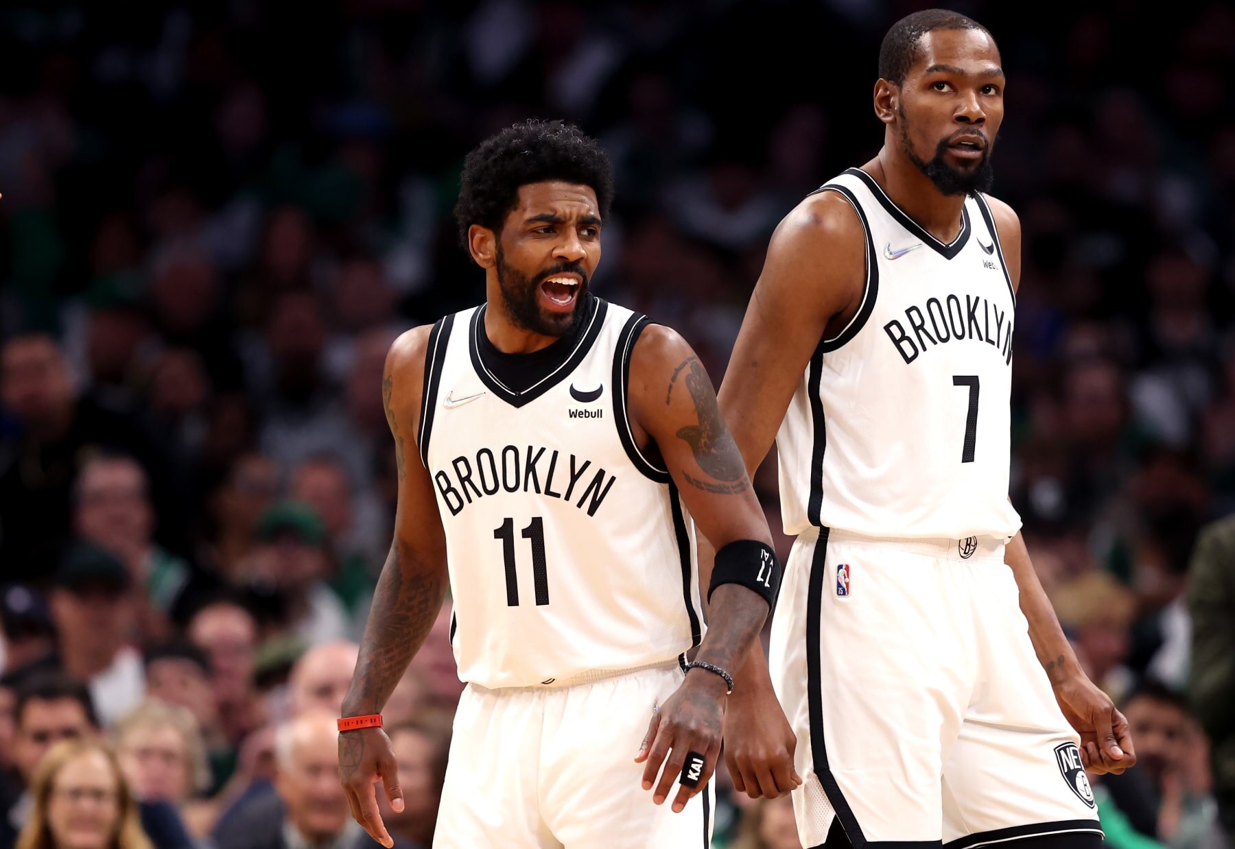 BOSTON, MASSACHUSETTS - APRIL 17: Kyrie Irving #11 of the Brooklyn Nets and Kevin Durant #7 look on during the first quarter of Round 1 Game 1 of the 2022 NBA Eastern Conference Playoffs against the Boston Celtics at TD Garden on April 17, 2022 in Boston, Massachusetts. (Photo by Maddie Meyer/Getty Images)