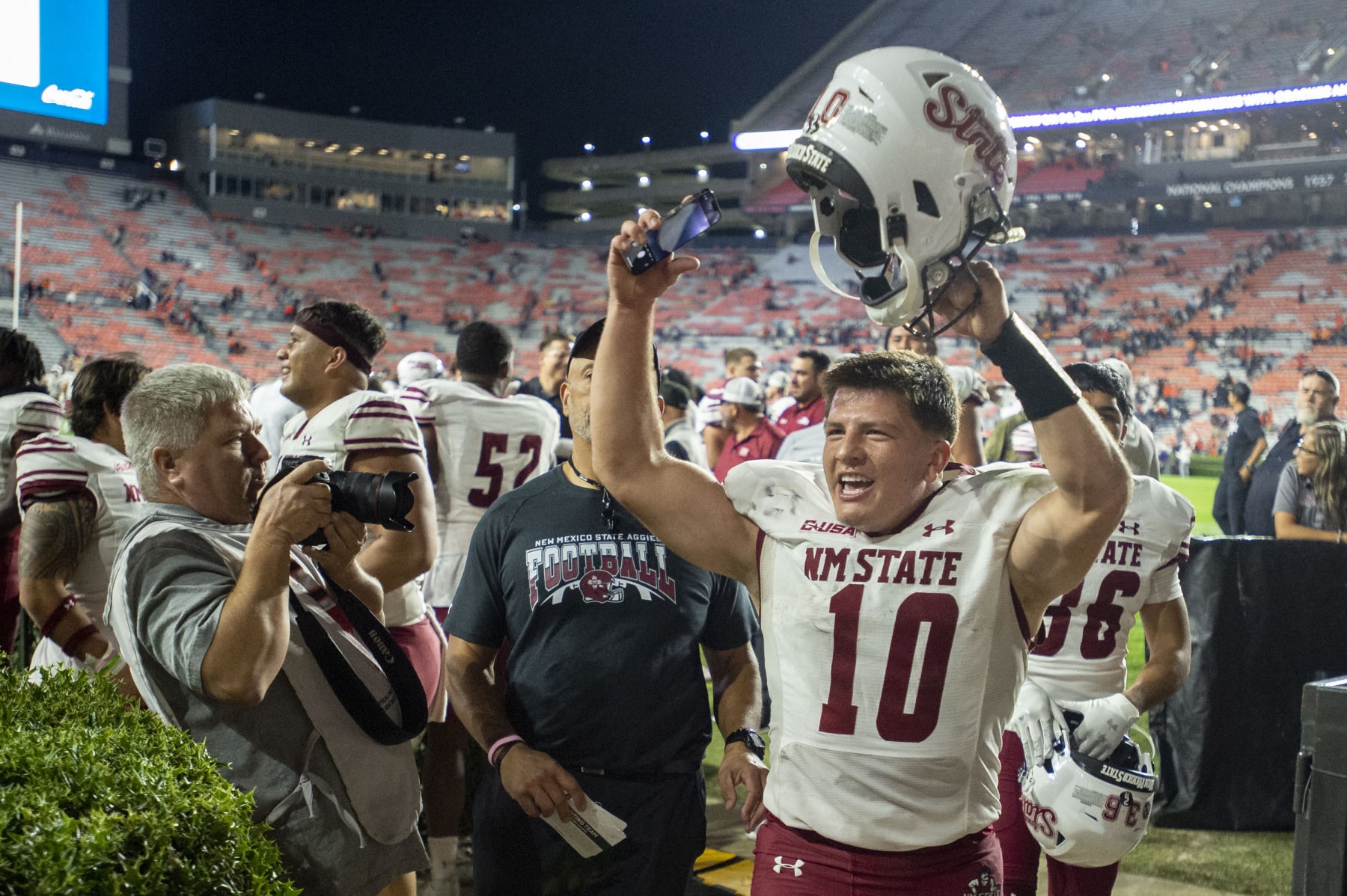 New Mexico State quarterback Diego Pavia celebrates a win against Auburn