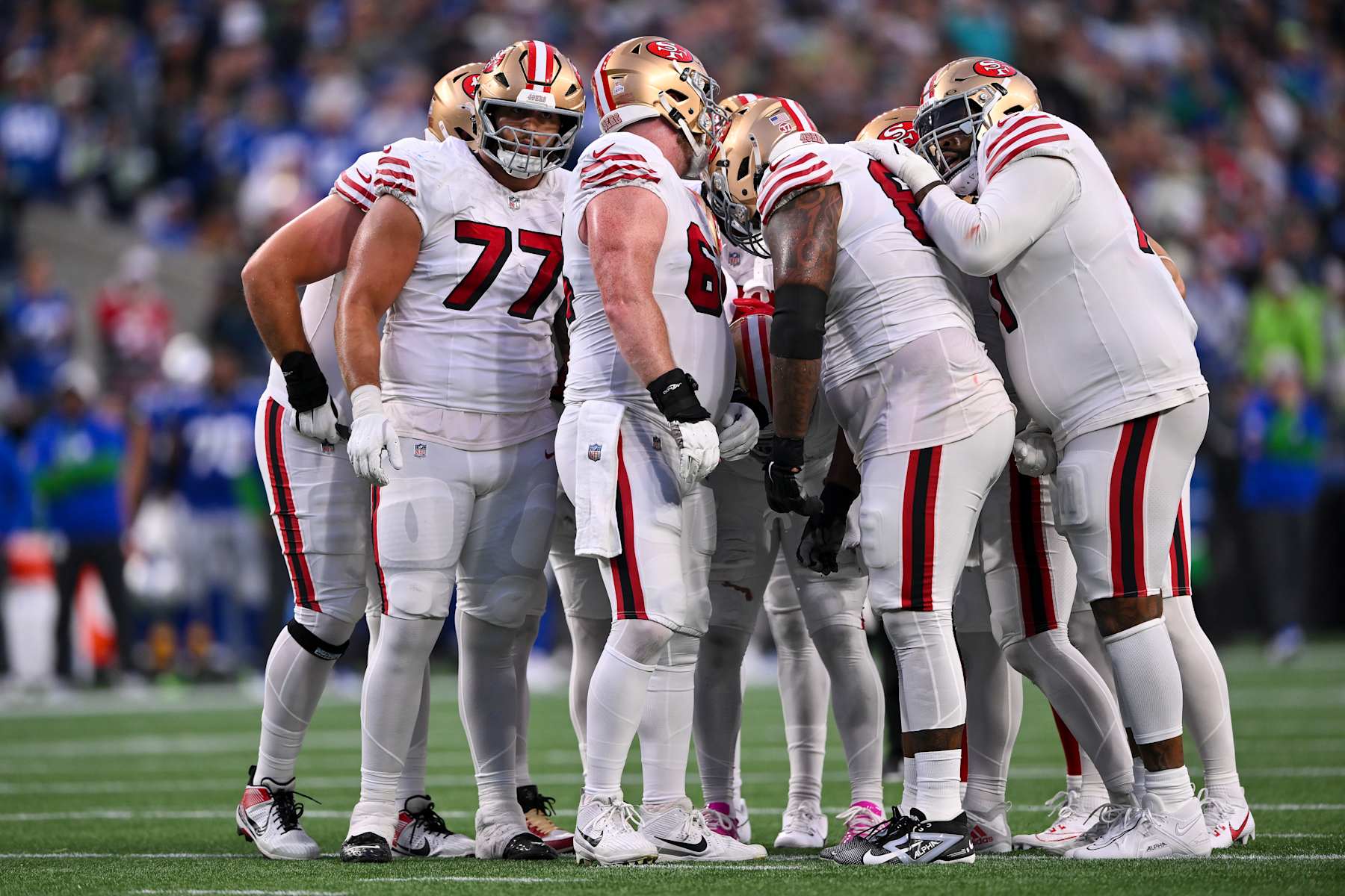 SEATTLE, WASHINGTON - OCTOBER 10: The San Francisco 49ers offense huddle during the game against the Seattle Seahawks at Lumen Field on October 10, 2024 in Seattle, Washington. The San Francisco 49ers won 36-24. (Photo by Alika Jenner/Getty Images)