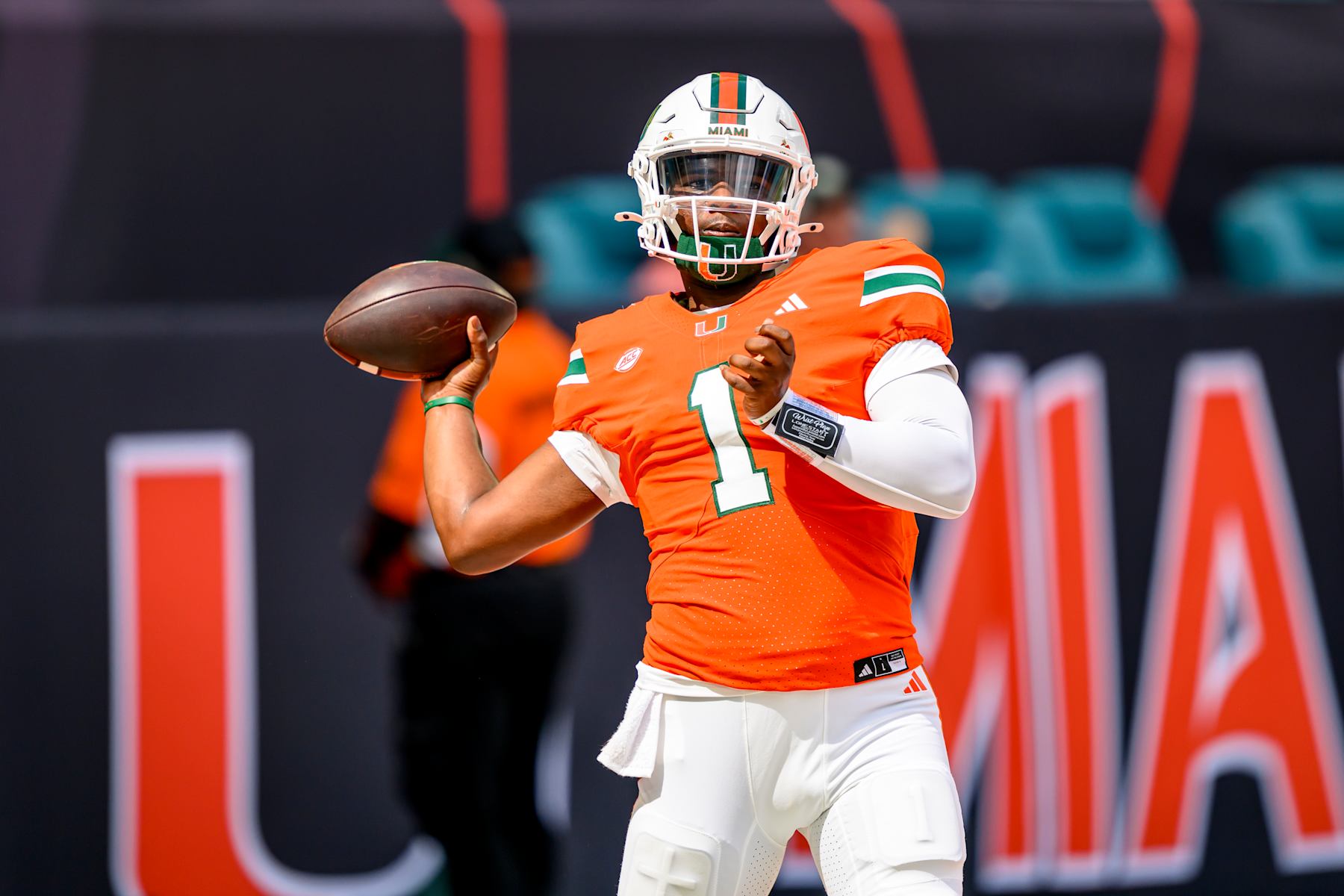 MIAMI GARDENS, FL - SEPTEMBER 14: Miami quarterback Cam Ward (1) throws the ball as he warms up before the college football game between the Ball State Cardinals and the University of Miami Hurricanes on September 14, 2024 at the Hard Rock Stadium in Miami Gardens, FL. (Photo by Doug Murray/Icon Sportswire via Getty Images)