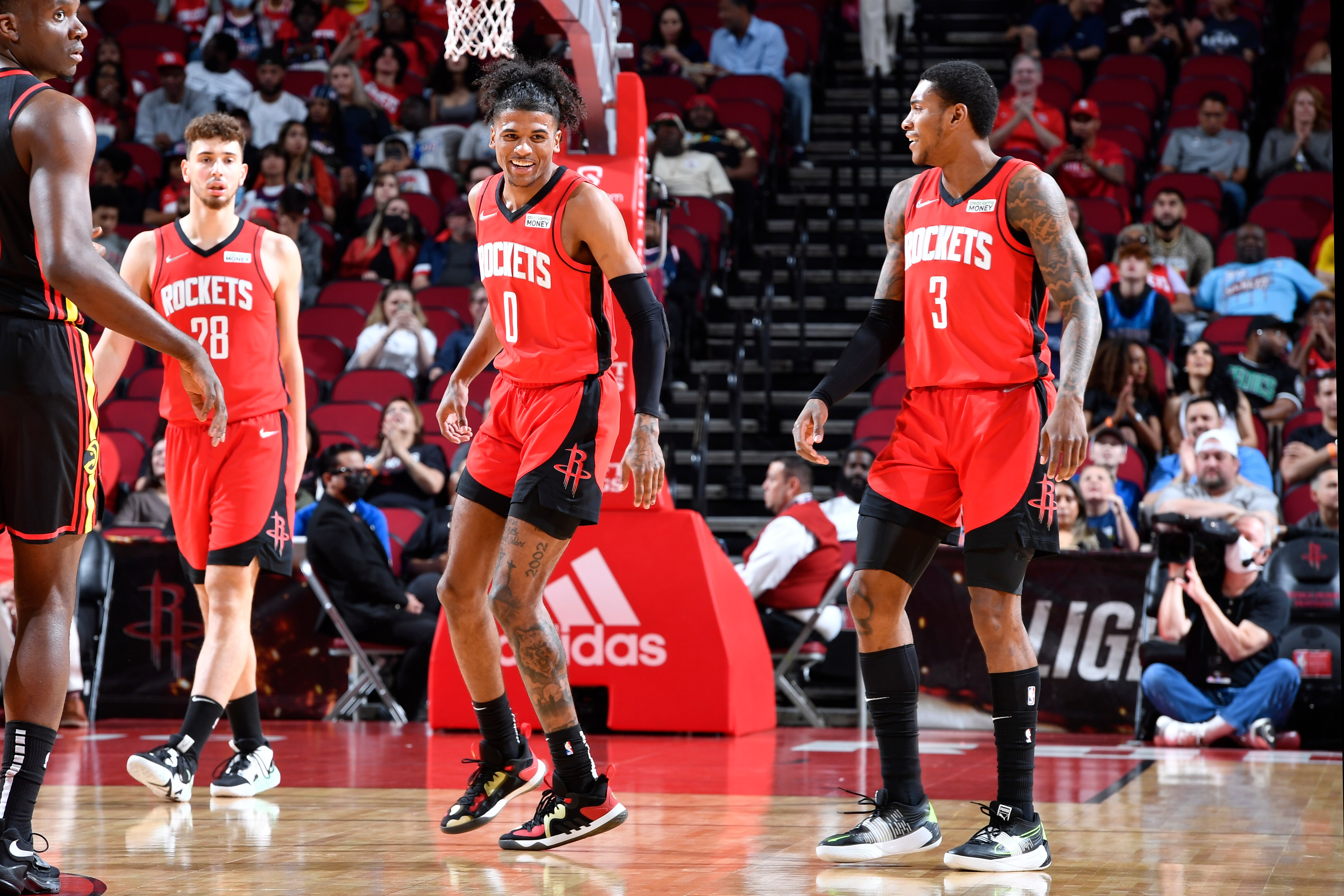 HOUSTON, TX - APRIL 10: Jalen Green #0 and Kevin Porter Jr. #3 of the Houston Rockets smile during the game against the Atlanta Hawks on April 10, 2022 at the Toyota Center in Houston, Texas. NOTE TO USER: User expressly acknowledges and agrees that, by downloading and or using this photograph, User is consenting to the terms and conditions of the Getty Images License Agreement. Mandatory Copyright Notice: Copyright 2022 NBAE (Photo by Logan Riely/NBAE via Getty Images)