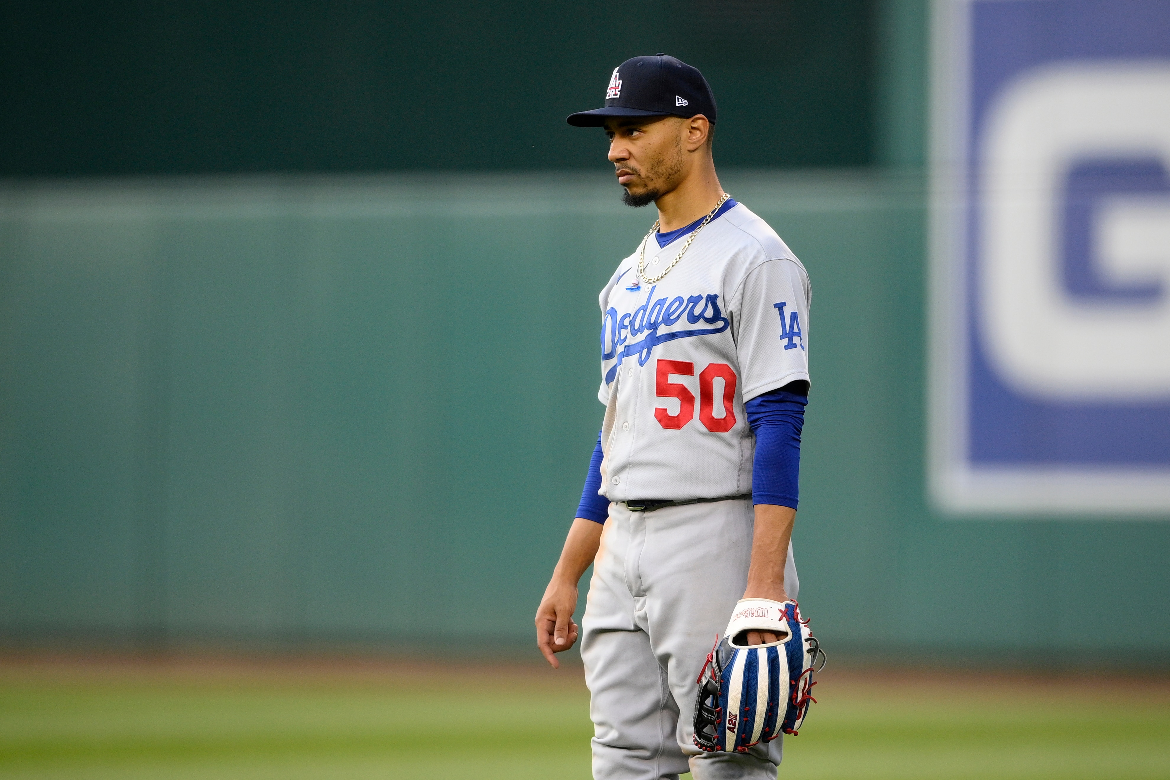Los Angeles Dodgers right fielder Mookie Betts stands on the field during a baseball game against the Washington Nationals, Saturday, July 3, 2021, in Washington. (AP Photo/Nick Wass)