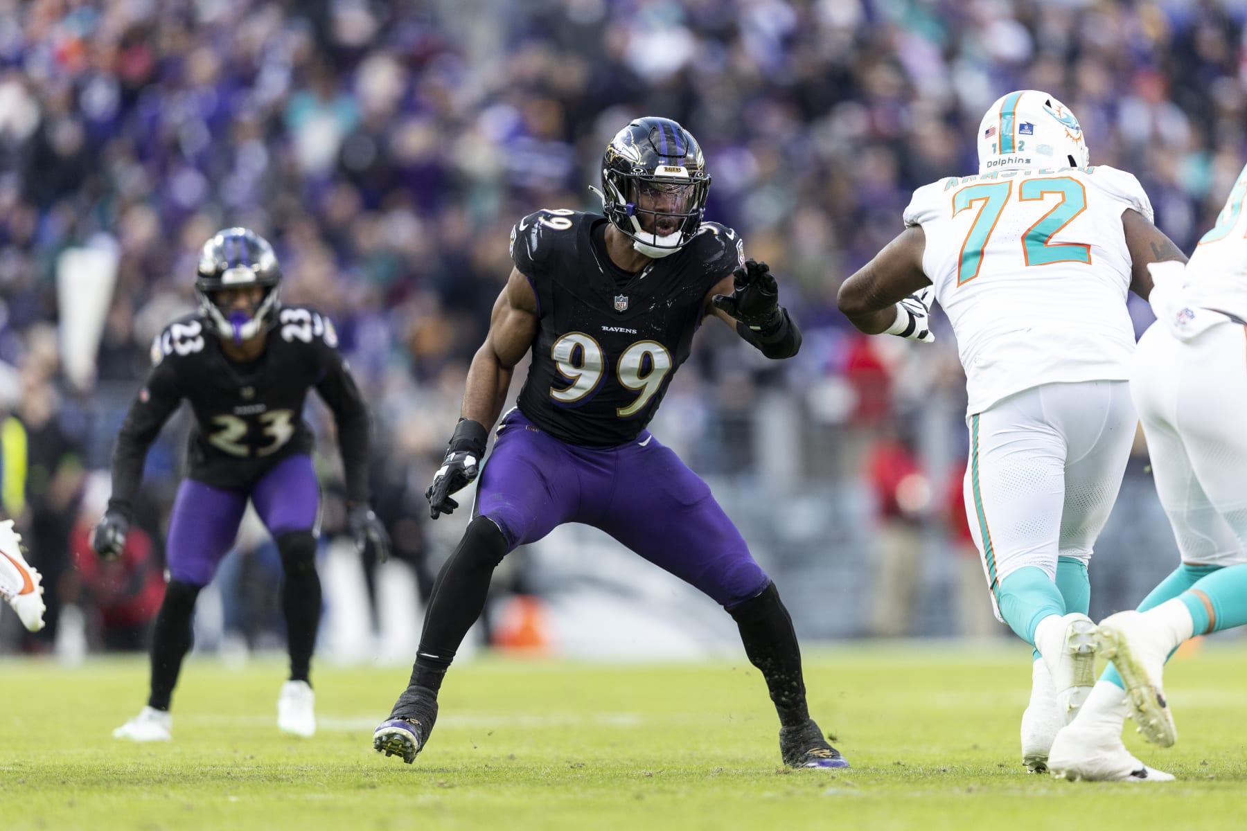 BALTIMORE, MARYLAND - DECEMBER 31: Odafe Oweh #99 of the Baltimore Ravens runs against Terron Armstead #72 of the Miami Dolphins during an NFL football game between the Baltimore Ravens and the Miami Dolphins at M&T Bank Stadium on December 31, 2023 in Baltimore, Maryland. (Photo by Michael Owens/Getty Images)