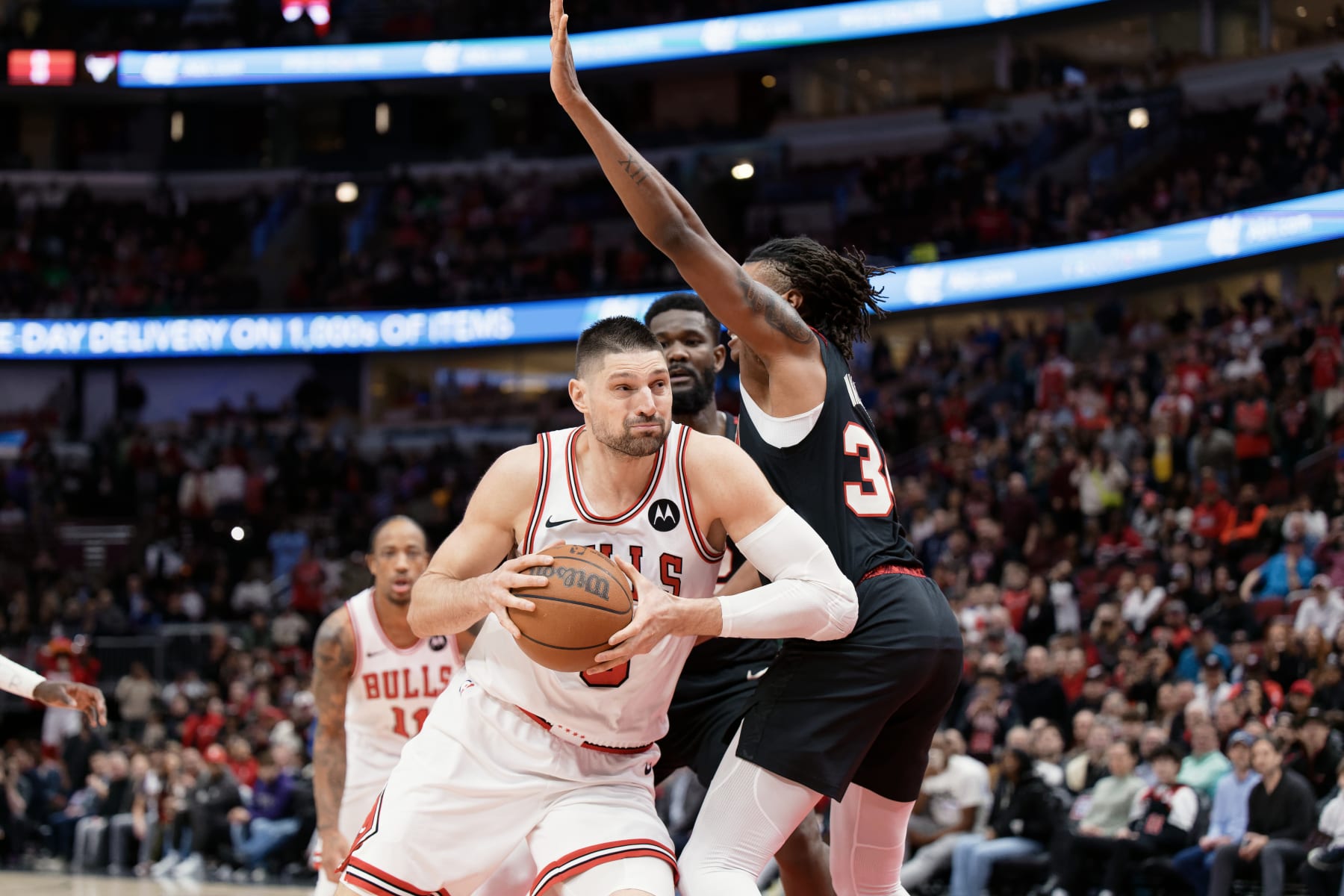 CHICAGO, ILLINOIS - MARCH 18:  Nikola Vucevic #9 of the Chicago Bulls controls the ball against the Portland Trail Blazers on March 18, 2024 at United Center in Chicago, Illinois. Chicago defeated Portland 110-107.   NOTE TO USER: User expressly acknowledges and agrees that, by downloading and or using this photograph, User is consenting to the terms and conditions of the Getty Images License Agreement.  (Photo by Jamie Sabau/Getty Images)