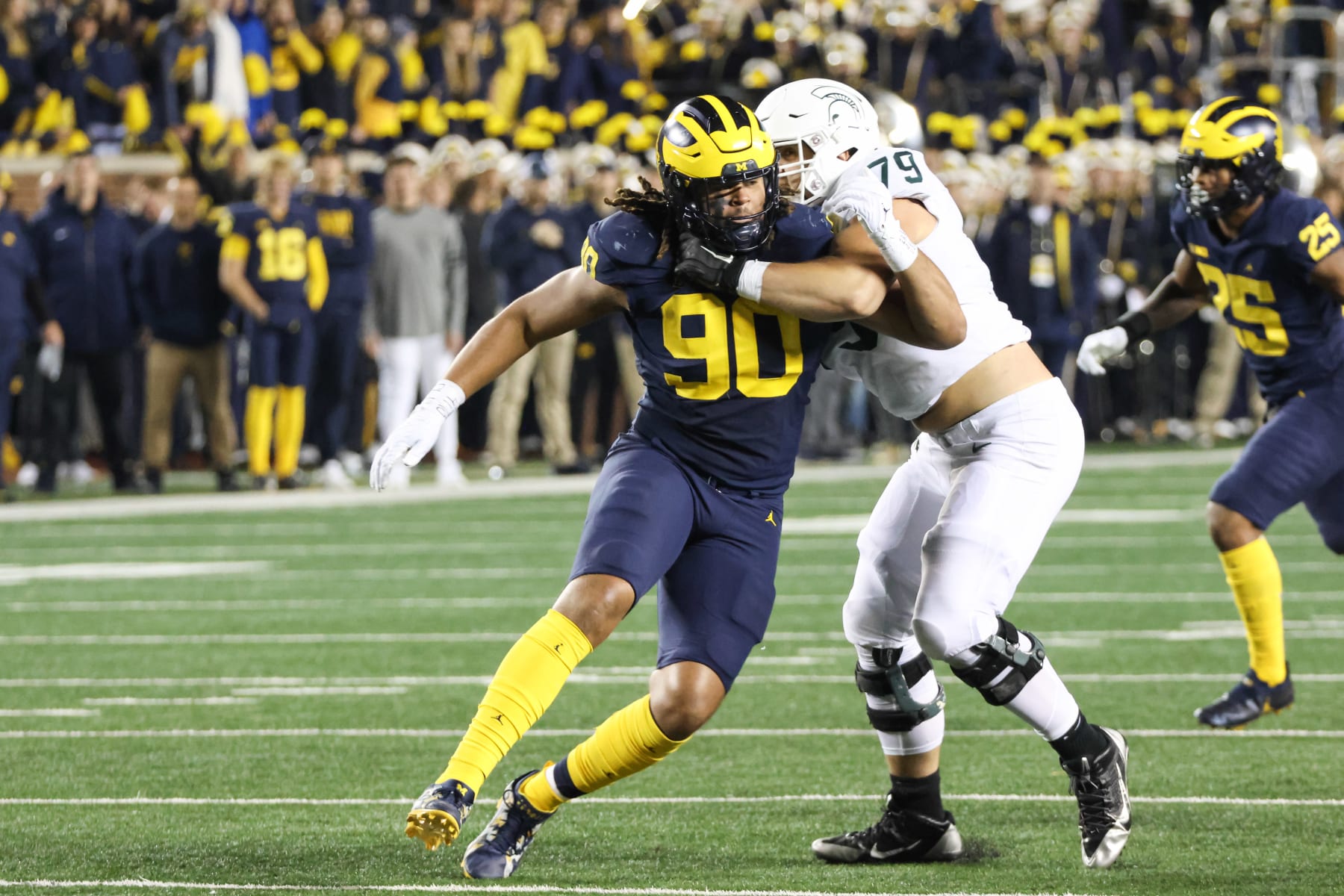 ANN ARBOR, MI - OCTOBER 29:  Michigan Wolverines defensive end Mike Morris (90) rushes against Michigan State Spartans tackle Jarrett Horst (79) during a college football game between the Michigan State Spartans and the Michigan Wolverines on October 29, 2022 at Michigan Stadium in Ann Arbor, Michigan.  (Photo by Scott W. Grau/Icon Sportswire via Getty Images)
