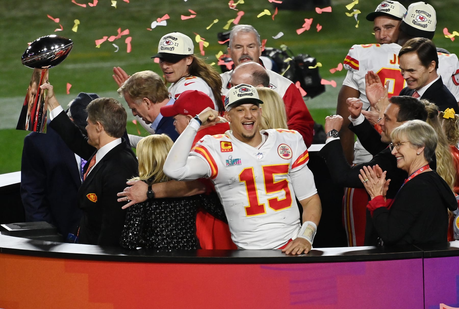 GLENDALE, ARIZONA - FEBRUARY 12: Head coach Andy Reid and quarter back Patrick Mahomes #15 of the Kansas City Chiefs stands on the podium with owner Clark Hunt celebrating with the Lombardi Trophy after they defeated the Philadelphia Eagles 38-35 in Super Bowl LVII at State Farm Stadium on February 12, 2023 in Glendale, Arizona. (Photo by Focus on Sport/Getty Images)