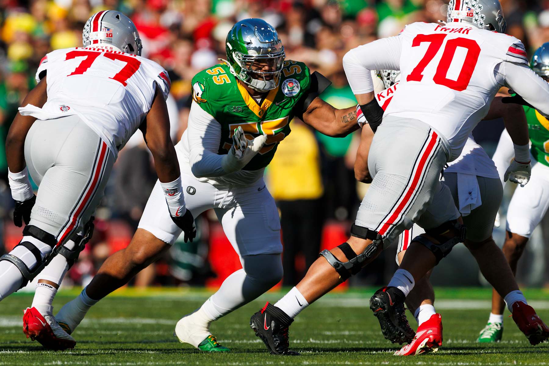 PASADENA, CALIFORNIA - JANUARY 1: Derrick Harmon #55 of the Oregon Ducks rushes the edge in the first half during the Rose Bowl against Ohio State Buckeyes at Rose Bowl Stadium on January 1, 2025 in Pasadena, California. (Photo by Ric Tapia/Getty Images)
