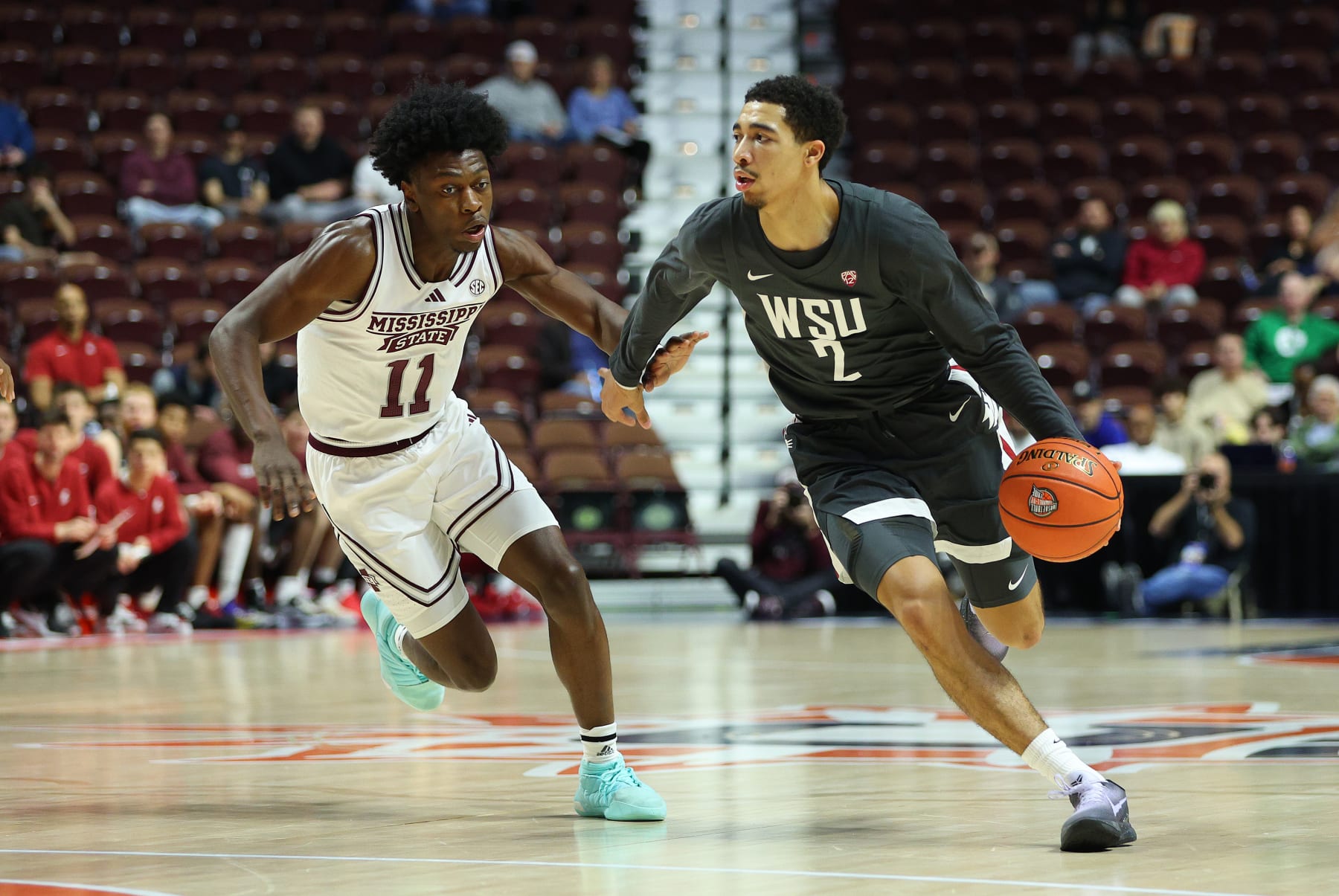 UNCASVILLE, CT - NOVEMBER 18: Washington State Cougars guard Myles Rice (2) drives past Mississippi State Bulldogs guard Trey Fort (11) during the Basket Hall of Fame Tip Off game between Mississippi State Bulldogs and Washington State Cougars on November 18, 2023, at Mohegan Sun Arena in Uncasville, CT. (Photo by M. Anthony Nesmith/Icon Sportswire via Getty Images)